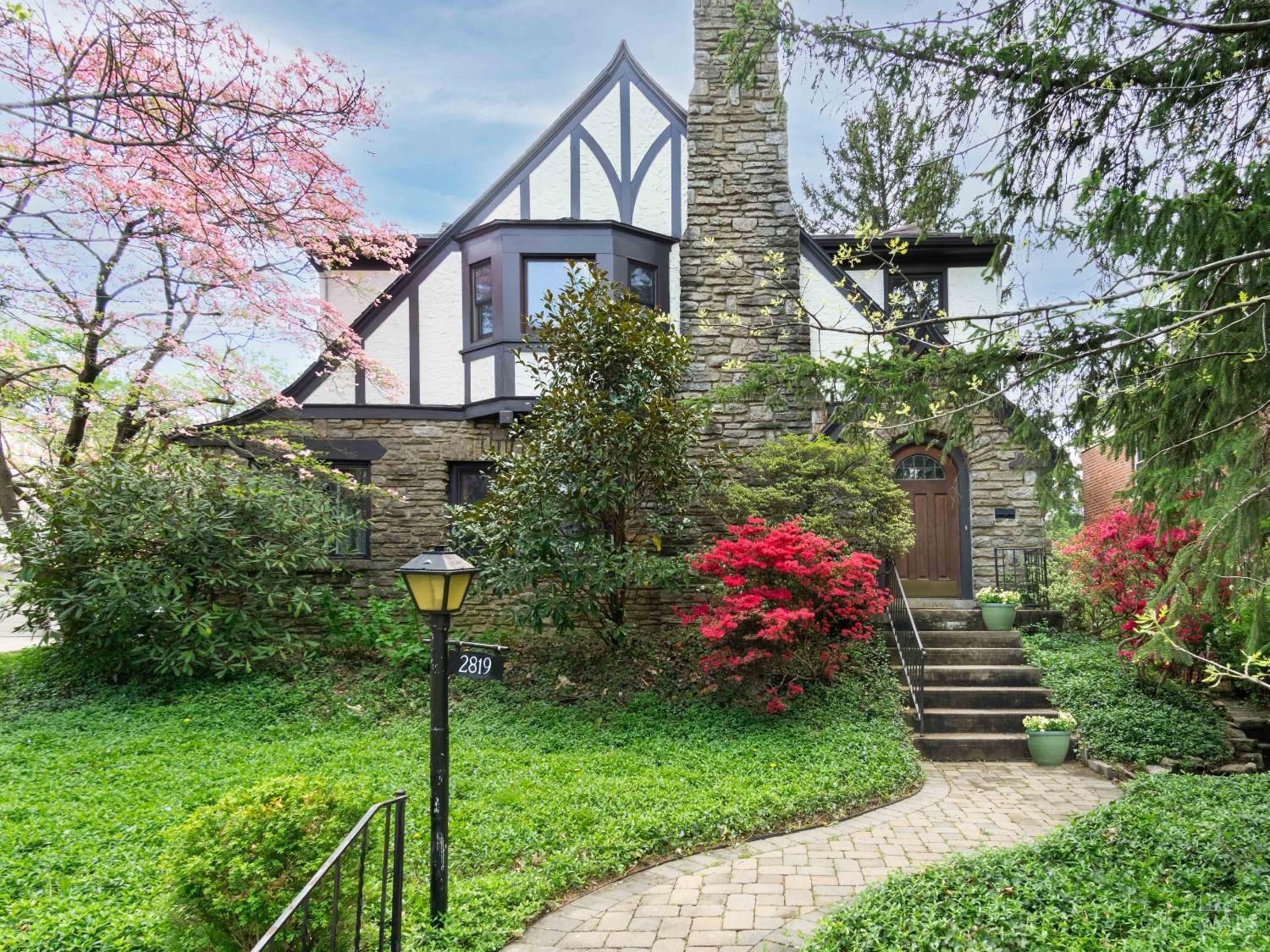 So much to love about this Hyde Park Tudor! Light filled living room features a beamed ceiling and stunning stone fireplace. First floor study with views of beautiful flowering trees. Large eat in kitchen with counter bar walks out to private deck. Four spacious bedrooms, wood floors, first floor laundry, newer windows, high ceilings, Walk to Hyde Park Square
