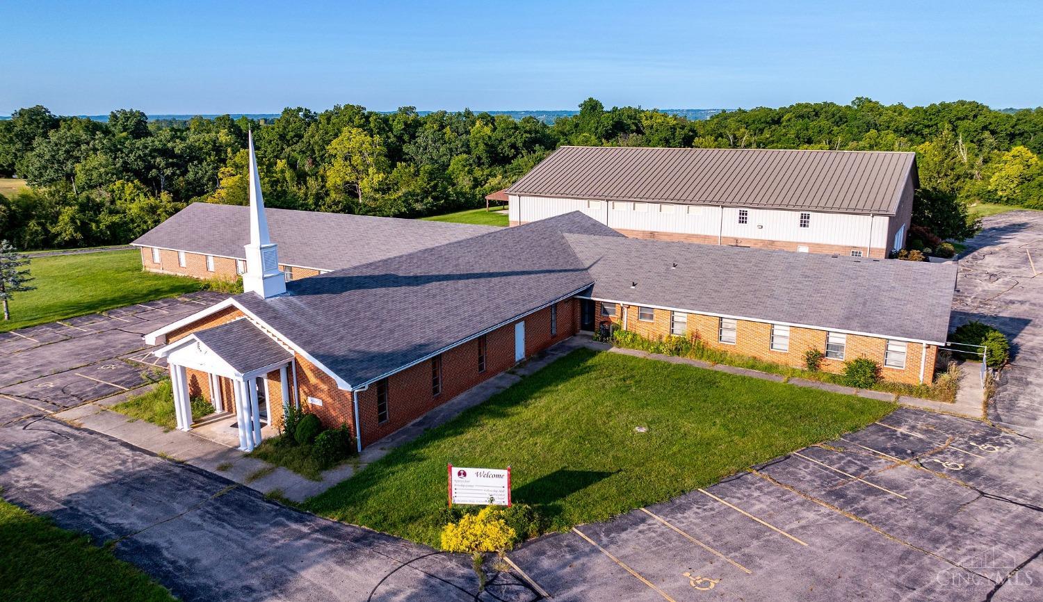 Wow!!!  Two huge buildings with endless opportunities.  Front building is the old church which consists of 9070 square feet!  Sanctuary, kitchen, 15 classrooms/offices, Huge bathrooms, and an enormous gathering room. Second building was built as a gymnasium and is newer than the front building.  It is currently being used as a sanctuary, 14 classrooms/offices along with numerous bathrooms.  The total property consists of 6+ acres and a shelter/shed.  Ample parking for both buildings and room to grow if need be.