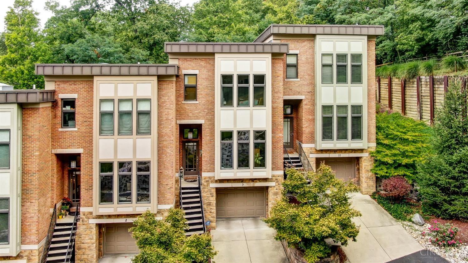 Custom high-quality finishes for a low maintenance luxury lifestyle! Designer kitchen with open concept, Thermador gas range, and counter bar seating. Spacious Living Room featuring hardwood floors and gas fireplace. French doors out to private patio with grass and wooded view. Primary Suite with tray ceiling, soaking tub, separate shower, walk-in closet. 2 ensuite Bedrooms PLUS a Home Office AND 2nd floor Laundry. Low HOA. Pella Windows. 2 car tandem Garage. Situated away from Delta, yet walkable to Mount Lookout Square and Columbia Square!