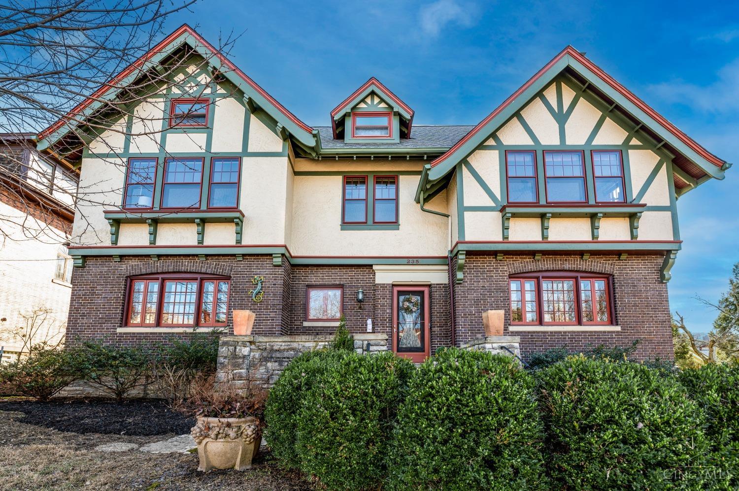 Truly Stunning Classic Tudor Home Designed by Samuel Hannaford in the Clifton Gaslight District! 3 stories (4 levels) of world class architecture featuring a gourmet chef's kitchen with custom island and copper sink! Multiple intricate stained-glass windows, alleged Rookwood Fireplace, pocket doors, beautiful & functional built-ins galore from bookcases to benches, newer exterior landscape with paver sidewalk and stone pathways, plus curated and original light fixtures, and a gorgeous screened porch overlooking specimen plantings. An additional 700+ sq ft of living space on the 3rd floor that was used as a ballroom for the current owner. Oversized 2+ garage built in 2001 with a loft. A must-see!