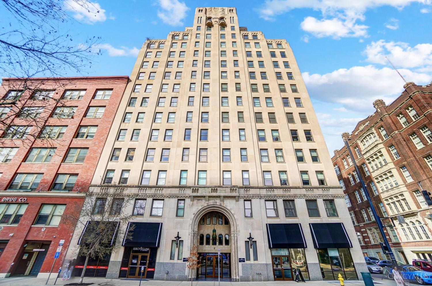 This modern 2 bed/2 full bath condo located in the historical American Building in OTR offers the perfect combination of style and convenience. With the 2 included garage spaces, enjoy the ease of coming and going. The corner unit's spacious living areas are filled with natural light and the open-concept kitchen offers a Subzero refrigerator, custom cabinets and granite countertops/backsplash. Use the clubhouse and 5th floor terrace w/ grill for a relaxing evening or party.