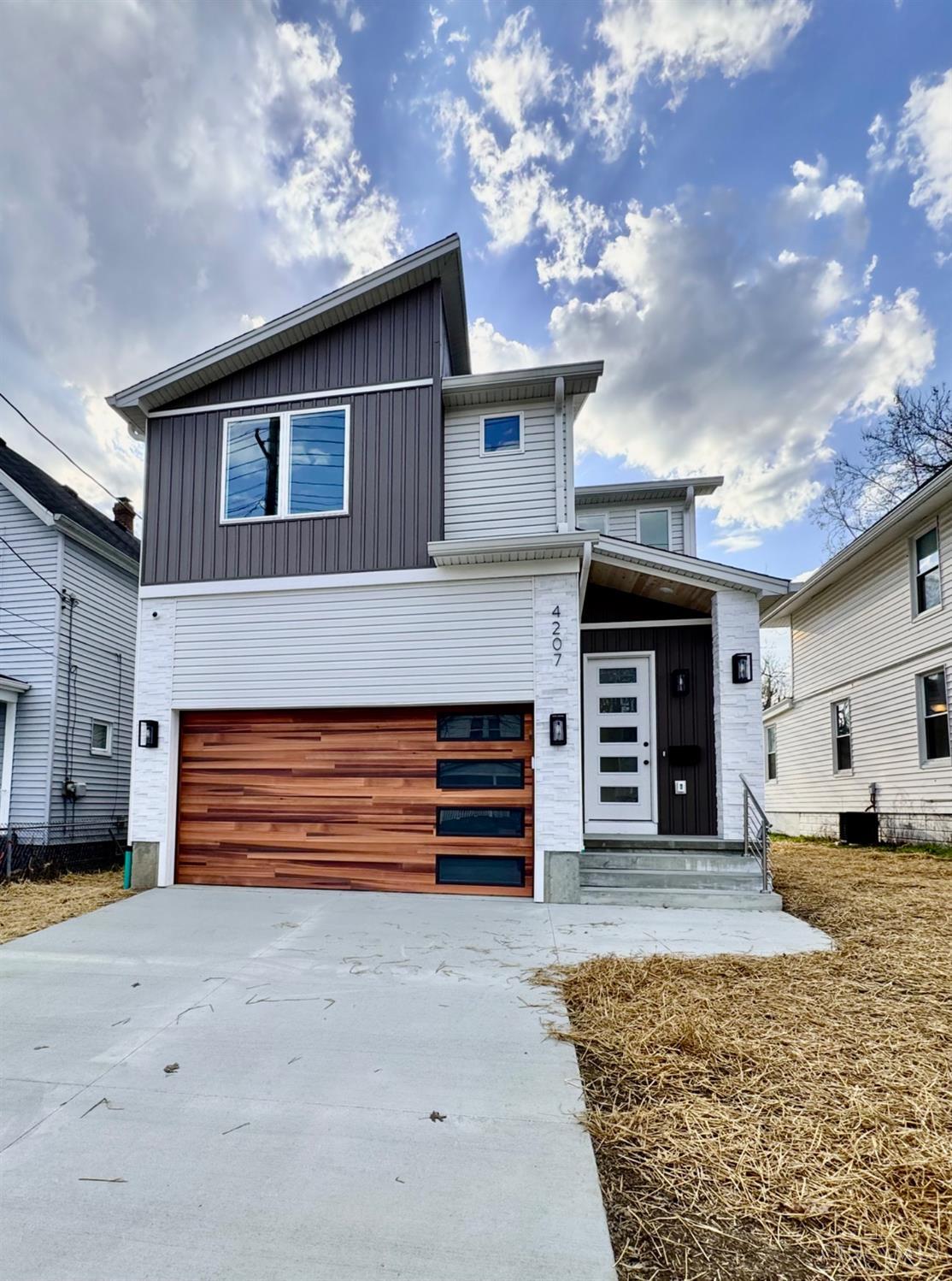 Stunning New Construction in Madisonville! 4 Beds 3.5 Baths. LEED Gold Certified. Main Level with 10 ft ceilings. Beautiful kitchen boasts Bosch appliances, a drawer microwave, a custom range hood, in-cabinet lighting, sit in oversized island, quartz countertops, and a spacious pantry, elegant dining room with tray ceiling, and seamless access to a covered porch. Second Floor with owner's suite with spa-like bath featuring a double shower, double vanity, and walk-in closet. Two additional bedrooms, a full hallway bath, and a convenient laundry room complete this level. Finished Lower Level with 9 ft ceilings, featuring an in-law suite (4th bedroom) with a full bath, a wet bar, and a wine coolerperfect for entertaining! Gas furnace and gas tankless Water Heater. 2 car garage with Electric Car wiring if needed. Exterior video surveillance. Tax abatement eligible till 2040. Move-in ready.