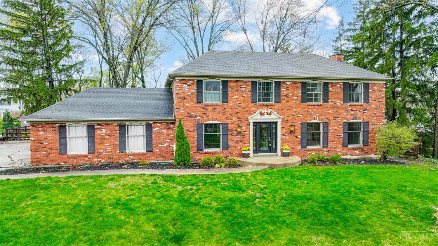 Tucked at the end of a quiet cul-de-sac, this stately brick colonial offers over 4,000 square feet of refined living space. With 4 spacious bedrooms, 3 full baths on the upper level, and 2 convenient half baths, this home is thoughtfully designed for both comfort and functionality. Gleaming hardwood floors flow throughout the first and second levels, enhancing the home's classic elegance. Recent updates include newer windows, roof, and mechanical systems providing peace of mind and modern efficiency. The finished lower level features a generous recreation room, a private study, and a half bath perfect for work, play, or relaxation.  Step outside to your beautifully manicured, fenced-in backyard and unwind on the expansive 28' x 14' screened-in porch ideal for entertaining or enjoying quiet mornings. Pride of ownership shines through every detail of this exceptional home!