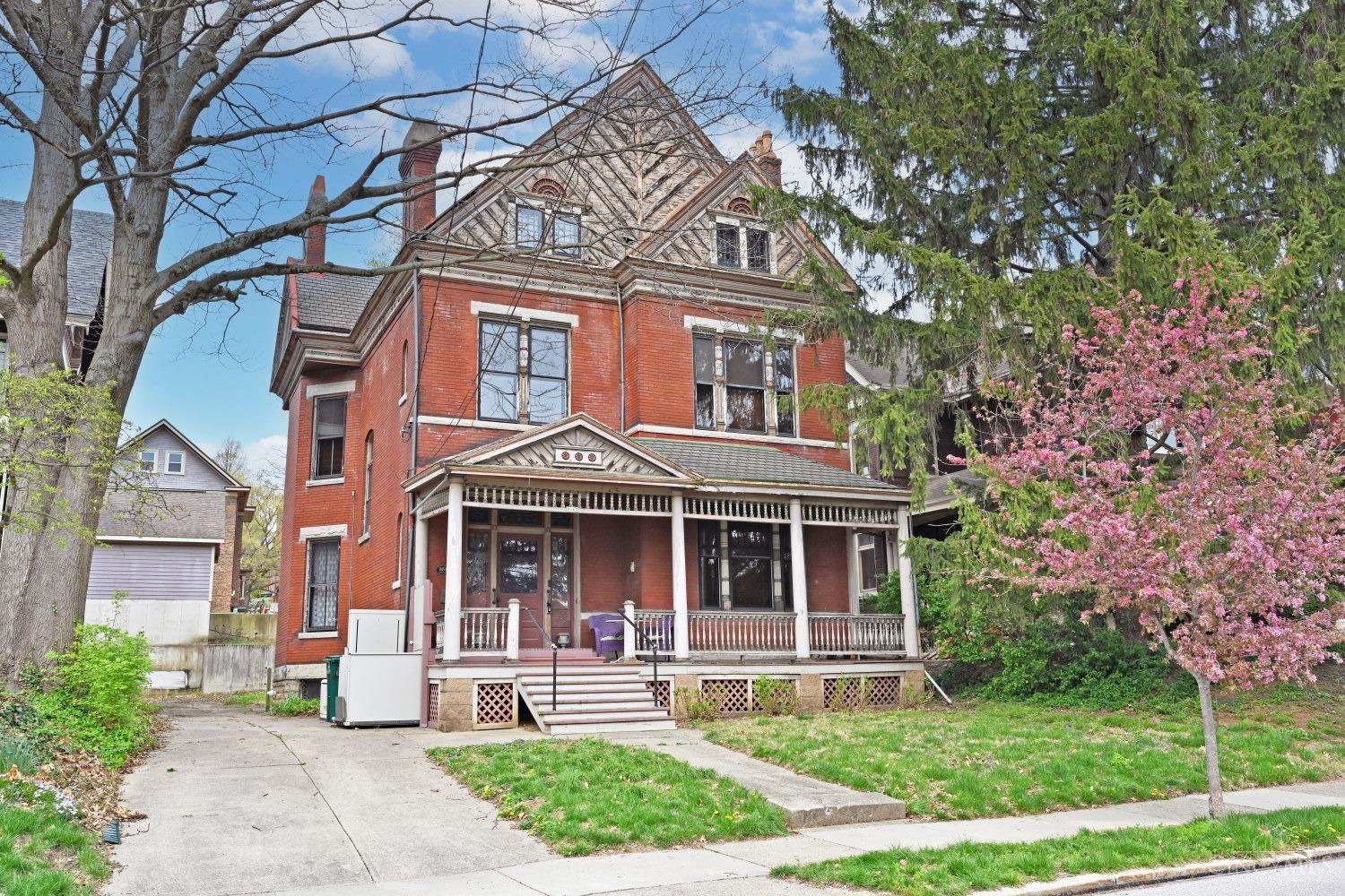 Stately Clifton home lovingly maintained by the same owner/enthusiast since 1992. Historical details abound, meticulously preserved & restored inside alongside tasteful updates to the kitchen, baths, laundry & mechanicals. A sprawling front porch welcomes guests, while a gorgeous transom lit entry welcomes them in w/stained glass, picture frame hw floors & a beautifully carved banister. Formal dining & living rooms beyond each feature 1 of 8 fireplaces + 2 working sets of pocket doors & a charming powder room tucked away. The library transports you to a bygone era & serves well as a 1st Fl family/den while the gourmet kitchen impresses (w/built-in butler's pantry, broom closet, & walk-in pantry), w/access to the back stairwell & LL as well as the backyard. On the 2nd Fl lies a cozy study & 3 comfortable bedrooms, served by a hall bath & laundry rm, while the 3rd Fl features an airy great rm & 2 more comfortable bedrooms & space for another bath to appoint as you see fit! A must see!