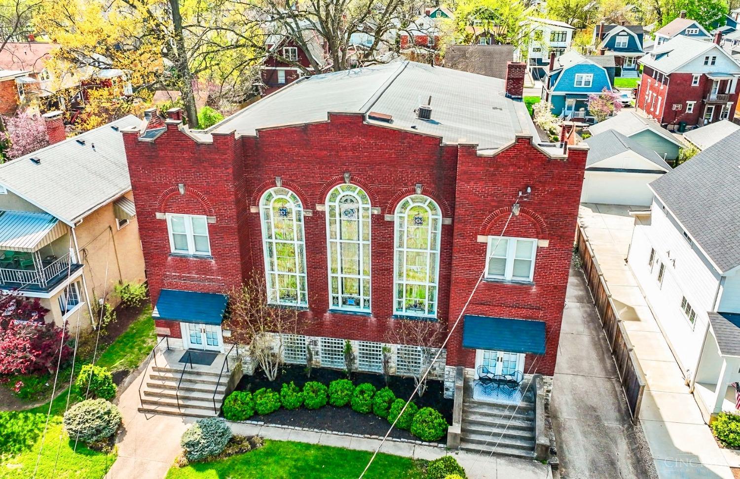 Historic church conversion, located in Oakley, offers an incredible opportunity for those seeking a truly unique living experience. With an impressive 7,500 sq ft, this property combines architectural details + extensive renovations. Soaring 25 ft ceilings w/stunning stained glass windows & original pipe organ, create a striking atmosphere. Imagine the parties & special occasions that can take place here! Expansive floor plan provides versatile opportunities for customization, allowing for home offices, artist studios, wellness areas, cooking/baking, or any of your hobbies. 2 huge Kitchen spaces w/top of the line appliances: 8 burner gas range, 60 in refrigerator/freezer, 3 dishwashers, ice maker, beer tap, wine & bev centers! Modern upgrades to plumbing, electric, HVAC, offer optimal comfort &  reasonable utility costs. New 3 Car Garage 2021 New patio w/gas fire table 2021. New Roof & Gutters 2015. New 2 person Sauna! Walkable neighborhood only 12 minutes from Downtown Cincinnati!