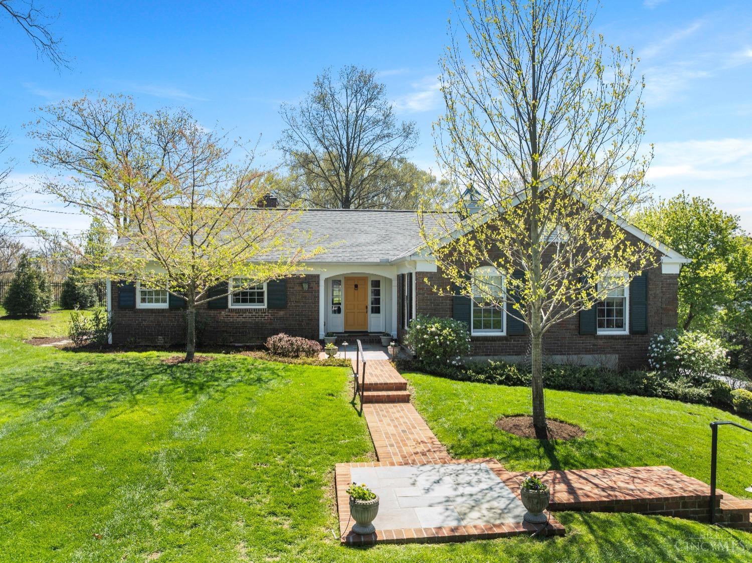 Located at the end of a quiet, private street in Hyde Park, 2787 Walsh Road offers timeless design and refined, primarily one-floor living. Fully renovated and reimagined in 2018, the home is elevator-ready and features a sun-filled gourmet kitchen with southern exposure, custom cabinetry, and a charming bay window. Formal and casual spaces blend with ease. A family room with 11+ foot ceilings opens to a brick patio and large serene backyard with views across the valley and wooded hills beyond. Includes a luxurious primary suite, guest suite, home office, and finished lower level with full bath, flex room, and built-ins. Oversized garage could accommodate up to four vehicles.