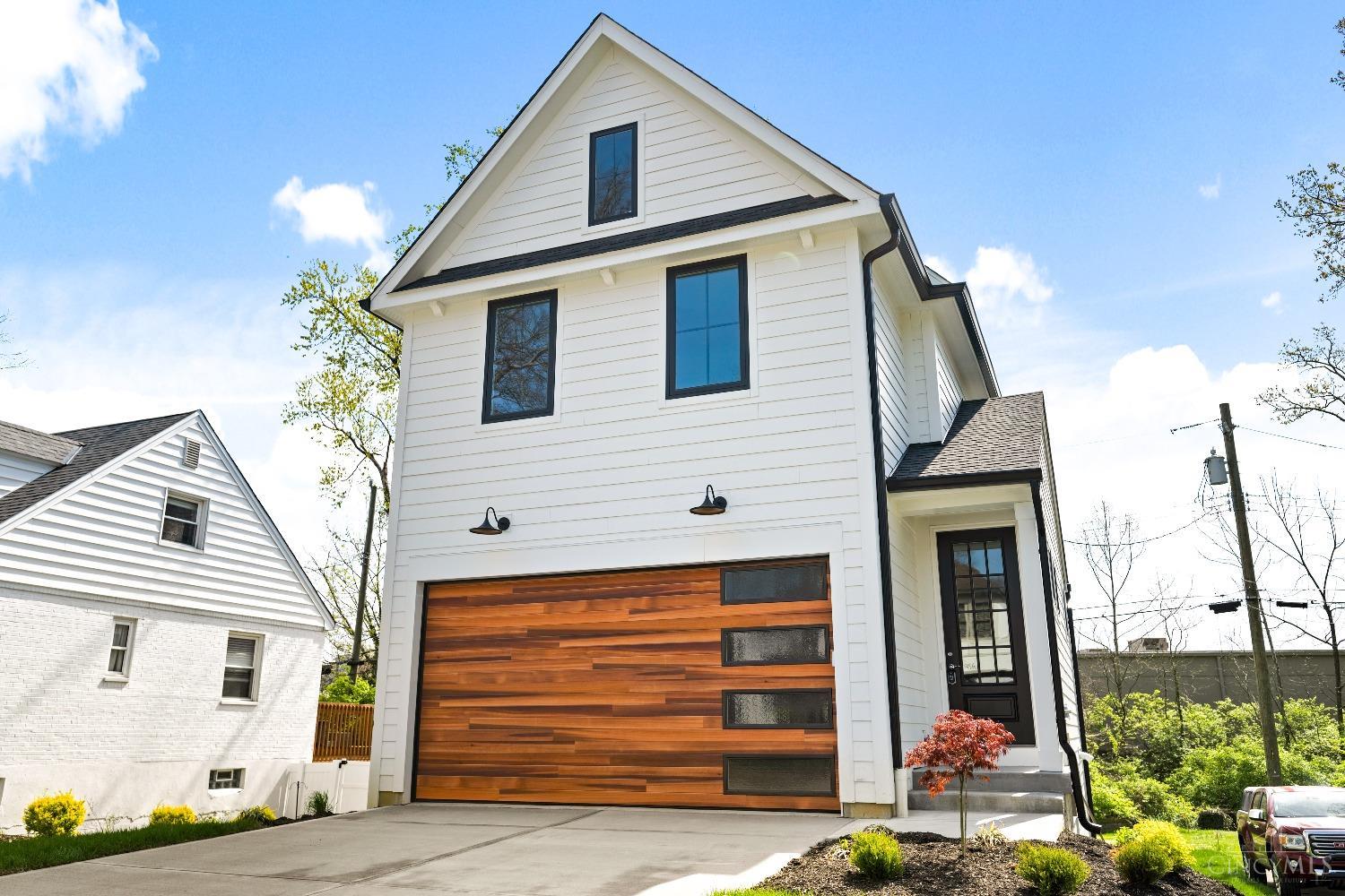 Terrific opportunity for move in ready new construction in Hyde Park; close to shops, restaurants and easy access to the I-71 corridor! 3 Bedrooms, 2.5 baths, 1,885sf build by Ashford Homes. This home is nestled on a picturesque treelined, sidewalk street. This home feels super bright and airy with wood floors, 9' ceilings, and large windows throughout. Two car garage, open floor plan, gourmet kitchen and a deck off the great room. The second level features a primary suite with a tray ceiling, dual vanity bath, two additional bedrooms, full bath and a laundry room. The finished, daylight lower level features a half bath and wet bar and walks out into the backyard under the deck. Leed gold and tax abatement eligible!