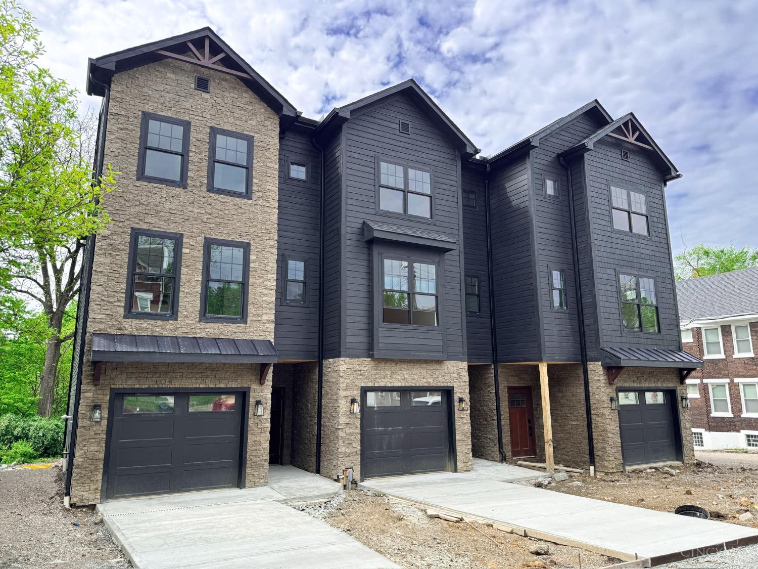 Completion date 5/1/25 for this 15 year, $600,000. Gold Leed certified tax abated townhomes. Spacious 2322 sq. ft. of luxurious living. Gourmet kitchen, quartz countertops, opens dining room, & great room, w/gas FP, & walkout to the large deck. Spacious owners suite, lg. WIC & bath, plus 2 additional guest rooms with en-suite full baths. Large lower level family room offers a walkout patio, & tree lined rear yard. Oversized 1 car garage & driveway. Assigned 6 car, plus 1 handicap parking space, offering you additional off street parking. You're just a short 3/10 mile walk to Eden Park river overlook, near Krohn Conservatory and Art museum. 5 minutes to downtown, I-75, Columbia Pkwy, parks, restaurants, nightlife, & shopping.