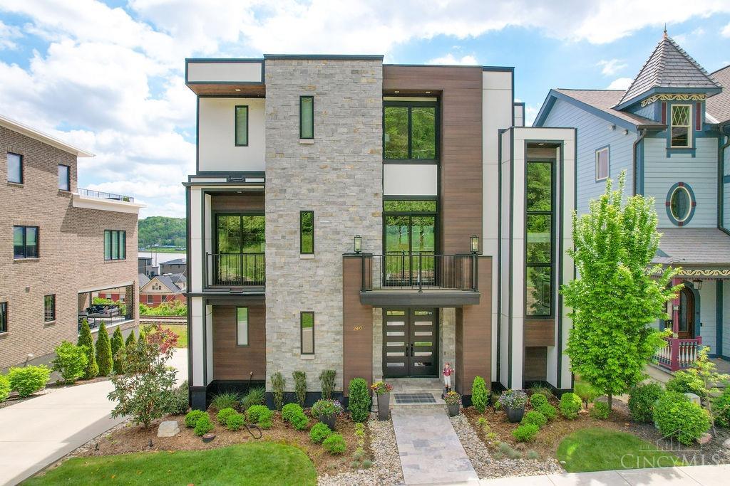 Exquisite dream home by award-winning Frazier Homes in Walworth Junction site of 2020 Homearama. LEED Gold 15-year tax abatement 10-11 yrs remain.One of a kind, totally custom 4 stories of luxury living w/elevator to all floors. Show stopper staircase! Enjoy fireworks from 4 decks w/stunning panoramic views of river & downtown Cincy! Chefs dream kit w/Thermador top-of-the-line appl, 6 burner gas cooktop, double ovens, huge frig, butler pantry & 10x4 island. Enormous 3rd fl private primary suite w/luxury bath, 13x13 closet, 2nd laundry & 20x14 sun deck. 1st floor 30x22 LR incl 12x12 wet bar & 10x8 deck. 2nd floor fm rm w/gorgeous gas fp, 15 ft glass door system leads to 19x18 covered deck for outdoor entertainment. Study/built-ins & balcony.16x 5deck for grilling. Lower-level rec room, guest bdrm & full bath. 3 car oversize garage w/12 ft ceiling & charging station. Zone HVAC & HWH.Pella doors & windows Energy Star rated. Prime location at end of street & close to parks, dining & shops.