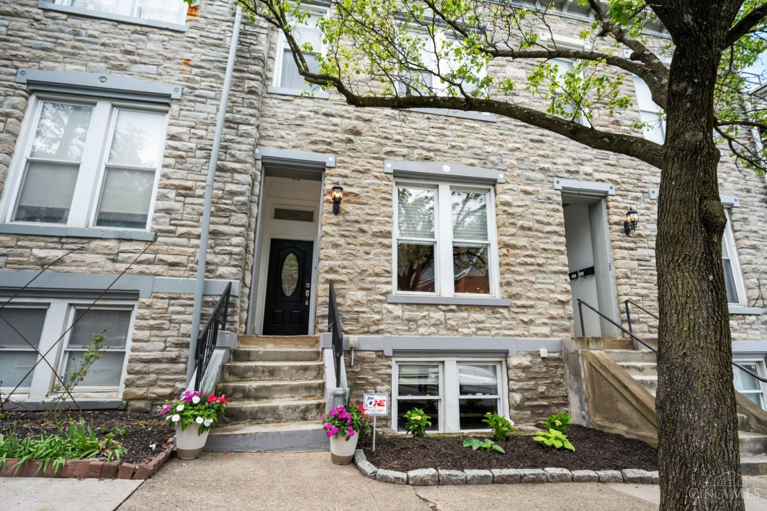 Rare opportunity to own a 3,127 sqft, architecturally unique, 3 story townhome with a FINISHED basement, perched atop the hill in historic Mt. Auburn. This home beautifully combines historic charm with modern updates and boasts, offering plenty of space to live, relax, and entertain comfortably. You'll love the dramatic open central staircase, soaring ceilings, tall baseboards, and hardwood on the main level. All 4 bedrooms are generously sized with ample closet space, 3 of 4 featuring en-suite baths. Additional highlights include a convenient second floor laundry and a finished basement with a wet bar, perfect for entertaining. Enjoy easy access to Hopkins Park, just outside your front door, and close proximity to Mt. Adams, downtown Cincinnati, and the University of Cincinnati. Option to lease a detached, 1 car garage for quarterly lease fee of $120 ($480/year).