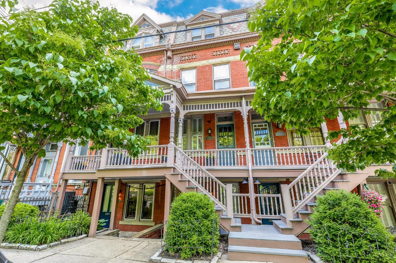 One of a kind circa 1870 home in the heart of vibrant Mt. Adams situated steps from Eden Park, Playhouse in the Park & Cincinnati Art Museum*Breathtaking panoramic city views from four levels*Masterfully updated w/unparalleled style, convenient versatility & historic charm well preserved*Exposed brick, soaring ceilings & dramatic walls of windows that flood the home with natural light*Updated + efficient eat-in KIT open to dining + living rooms*Spacious primary BR suite w/adjoining loft sitting area*Fully equipped 1 BR, 1 BA accessory dwelling unit in LL offers flexibility & versatility for guests or rental income*Drink in the view on three private decks & commune w/neighbors on the spacious covered front porch*Enjoy having the charms of Mt. Adams at your doorstep while living minutes from all Downtown has to offer.