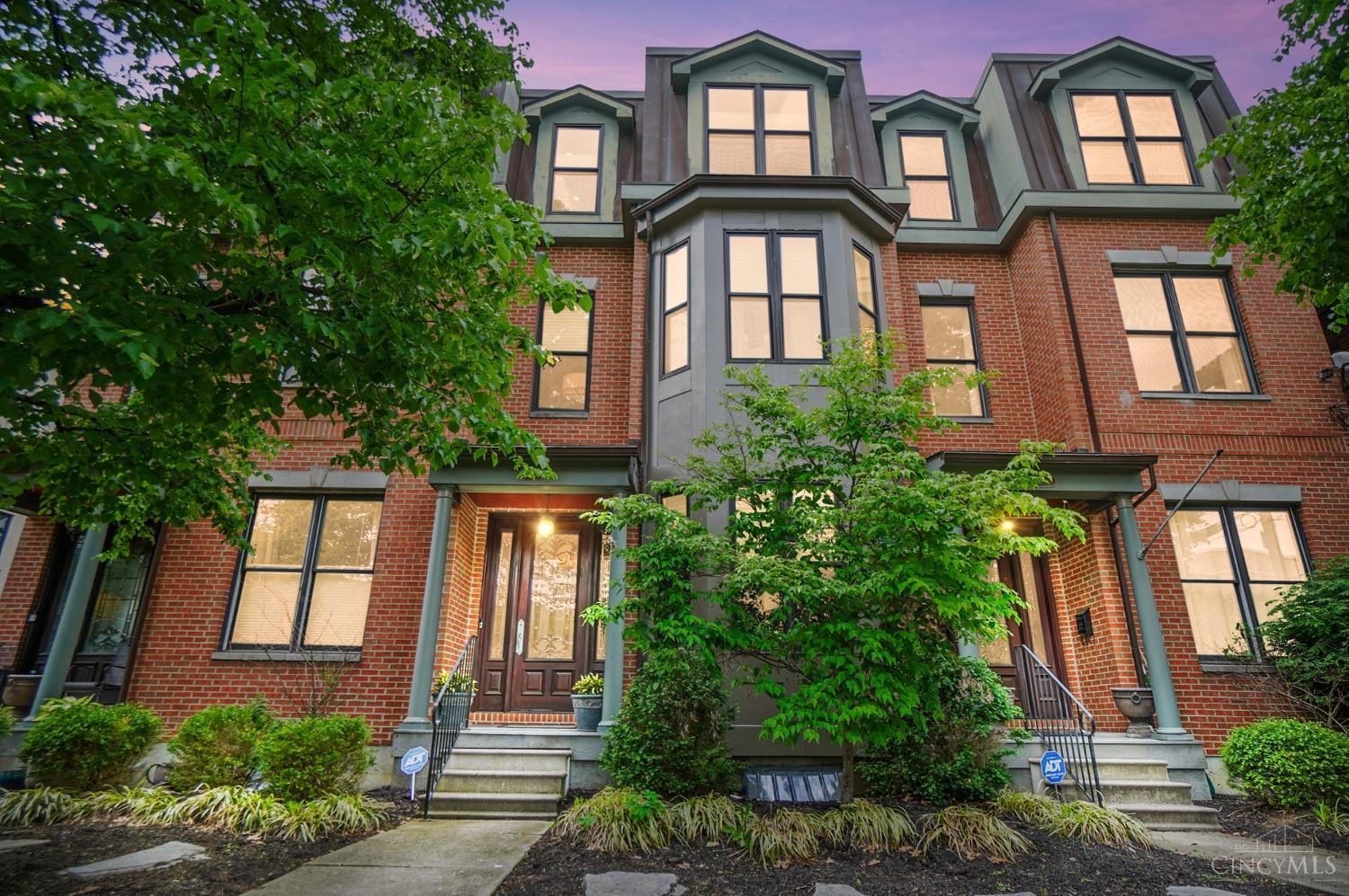 Luxury, flexibility, and location dialed in. With 2,808 sq ft above grade and a finished basement with egress, this East Walnut Hills row home delivers a smart layout and refined design across four levels. Soaring ceilings, hardwood floors, and a whole-home surround sound system sets the tone. The entry level offers a private guest suite or office, while the second floor opens to a chef's kitchen flowing into two spacious living areas, with sit down dining, and a walk-out terrace. The primary suite includes a spa-like bath, dual vanities, jetted tub, and walk-in closet. You will also find bedroom-level laundry, multiple work-from-home options, and an attached two-car garage. Built in 2000 with low-maintenance outdoor living, this home is tucked in a historic neighborhood steps from restaurants, shops, and hospitals. Clean lines, high function, timeless style - this home delivers on every level.