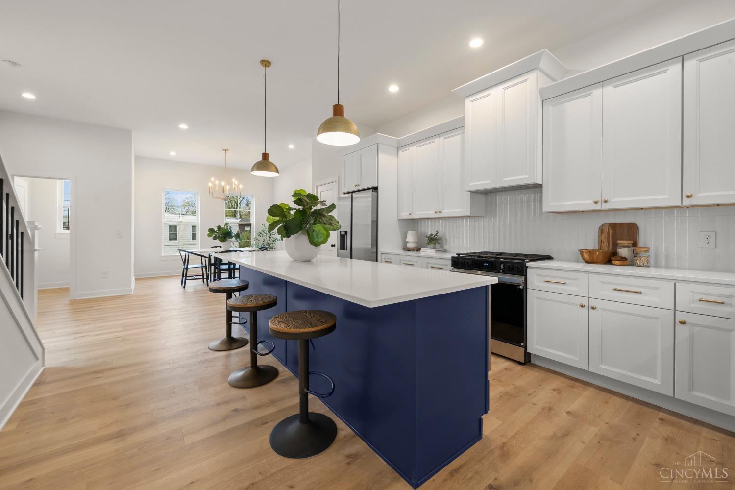 Stunning brand new 3 bed/2 full, 2 half bath home featuring an open floor plan, gourmet kitchen with quartz countertops and large island, top floor laundry room, and so much more. A spacious finished flex room, deck and patio make this a must-see! LEED Gold Tax Abatement Eligible - 10 year/100% of improved value.