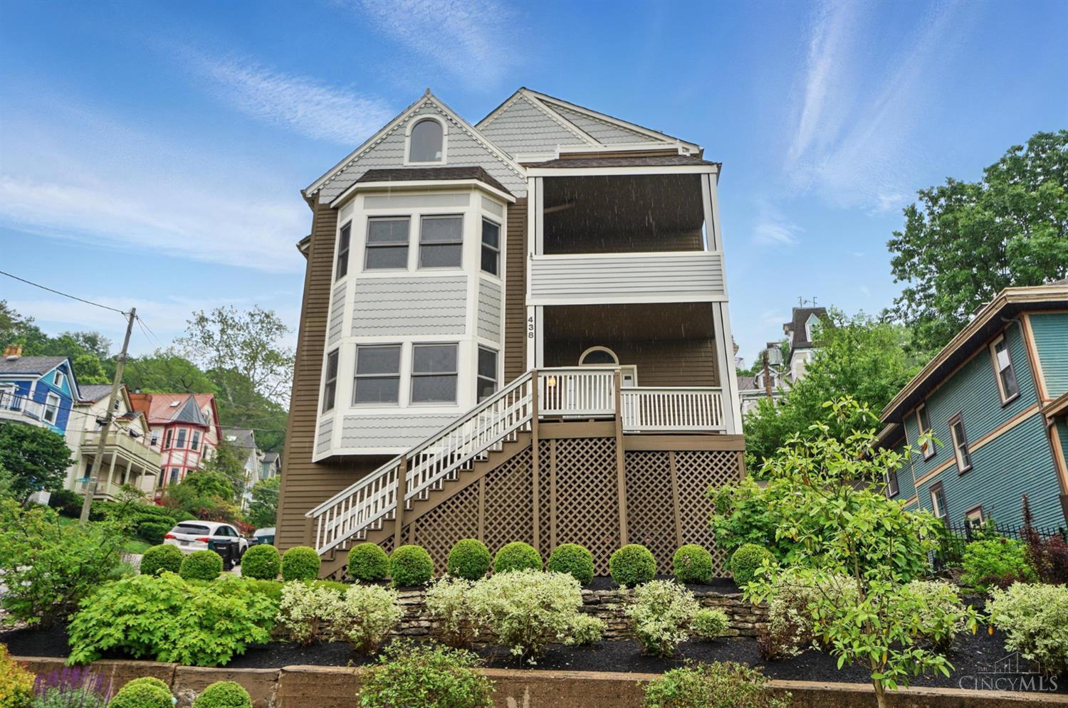 Here's your chance to live amongst the Painted Ladies in Historic Columbia Tusculum. Built in 1997, this freshly painted Victorian home has stunning views from multiple balconies, 4 gas fireplaces & hardwood floors. You'll enjoy fabulous views from every window in this unique home. The great room welcomes you as you enter the home with a cozy fireplace & wet bar/buffet area perfect for entertaining. The chef's kitchen opens to the dining area & has access to the covered balcony. All five bedrooms have walk-in closets. The incredible primary suite has its own private living area w/wet bar, fireplace & balcony overlooking Cincinnati. The primary bedroom has a fireplace, walk-in closet & updated full bath. Enjoy convenient 2nd floor laundry & a dumbwaiter for ease with groceries. 3 car garage & beautifully updated landscaped low maintenance fenced yard w/deck provide a private outdoor oasis. Just minutes to downtown, Hyde Park, Mt. Lookout & Alms Park.