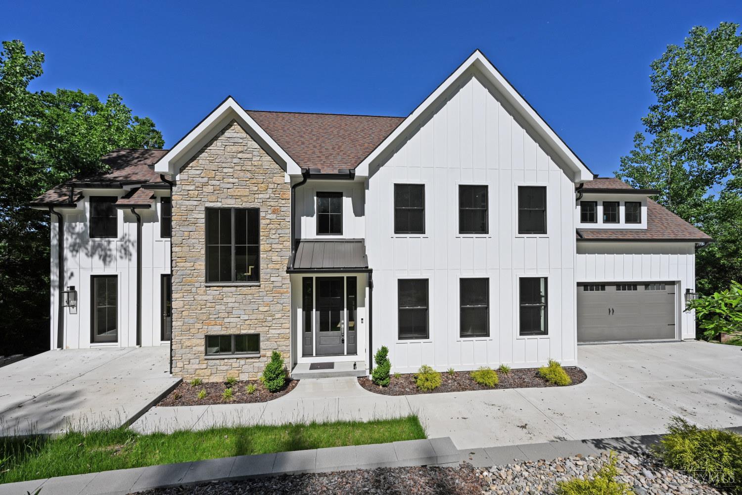 Come and enjoy this breathtaking, brand-new luxury home with LEED Gold Tax Abatement! Every inch is thoughtfully designed with high-end finishes. Gorgeous 9-inch oak floors, sleek quartz countertops, custom cabinets and handrails, and a stunning gas fireplace set the tone throughout. Designer lighting adds the perfect touch of elegance. The chef-inspired kitchen is equipped with top-of-the-line Thermador/Frigidaire/Sapphire appliances, plus a Hisense beverage cooler and wine fridge. The spacious butler's pantry is sure to impress, and the expansive patio is easily accessible from the oversized great room, perfect for entertaining.The second floor encompasses a large master suite with stunning spacious bath including gorgeous heated tile floor, double vanity, massive shower and great walk-in closet. 3 additional bedrooms and large rec room finish off the spacious living area.