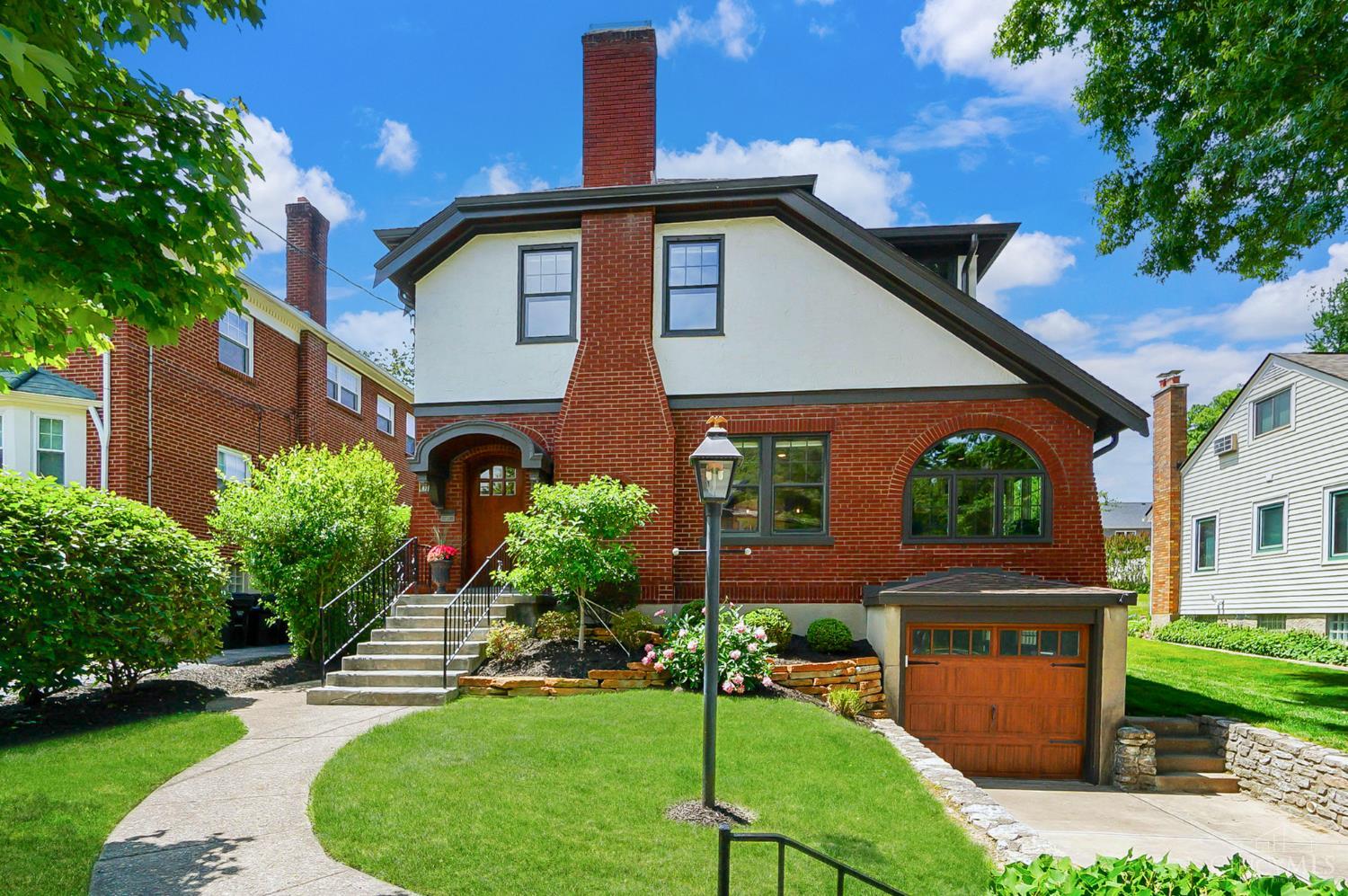 Completely redesigned 1920's Tudor with high quality features plus incredible walkability! Living Room featuring a Rookwood gas fireplace. New Kitchen 2021 with spacious Quartz island and Thermador/Bosch appliances! Wonderful Sun Room with hardwood floors and French doors makes a great Home Office. Custom Dining Room with built-ins. Rare to find first floor Family Room addition AND Primary Suite! New hardwood floors and carpet. Large 220 ft deep outdoor entertaining area with expanded patio and lights, new landscaping & stonework. Space to host, relax, and enjoy every season of life! Exterior painted 2023, new Garage Door, fenced yard. Walk to schools, swim club, dinners, or coffee!