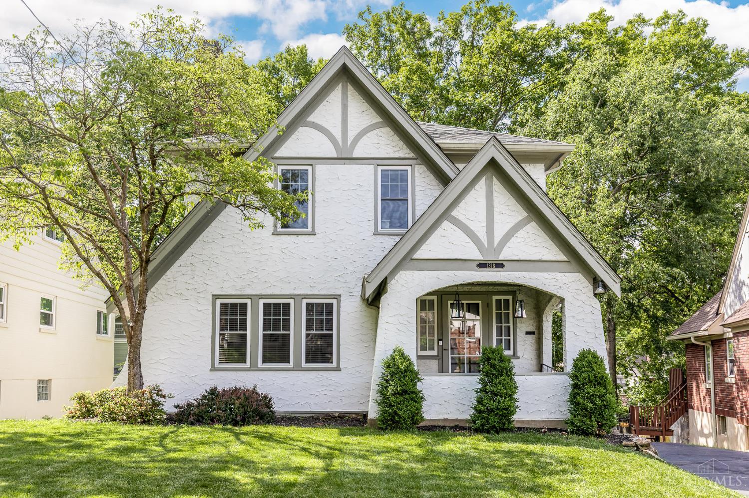Location!*Charm + modern amenities abound in this bright & inviting Tudor located on a quiet cul-de-sac street in the heart of Mt. Lookout*Thoughtfully updated & improved throughout w/timeless character well preserved*Hardwood floors*Arched doorways*Fresh/neutral spaces*Open floorplan living room/dining room*Updated KIT w/42 cabinets, granite, SS appliances*Spacious primary BR*Beautiful new primary BA*Built-in GAR*Covered front porch*Composite rear deck overlooks fully fenced yard*Well maintained w/an impressive roster of improvements*Live in the heart of it all on a quiet cul-de-sac street a half mile from Mt. Lookout Square, less than 1 mile from Ault Park & minutes from all Mt. Lookout & Hyde Park have to offer.
