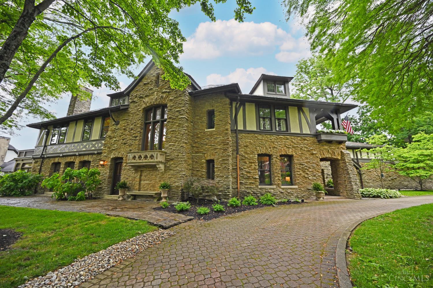Tucked behind Madison Road on a quiet private lane, this elegant Tudor is a very special property.  Large inviting rooms with open floor plan feel luxurious. This house includes a private pool and expansive outdoor entertaining area which is accessible through the living room, dining room and kitchen.  Solarium off of the living room fills the house with natural light.  The oversized garage fits four cars and has a nanny suite above it that is also connected to the second floor. Beechcrest is one of Cincinnati's finest streets located in East Walnut Hills.  It's a short walk to O'Byronville and Woodburn business districts and 10 minutes to downtown.