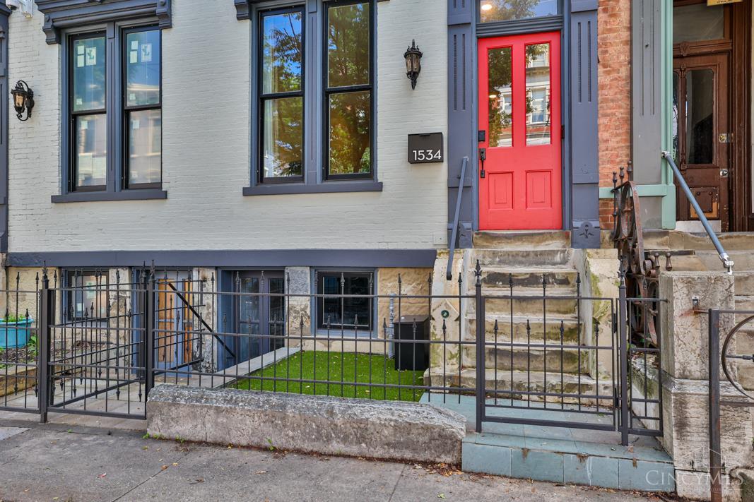 Historic Charm Meets Modern Updates in the Heart of OTR. Fully restored 3-bedroom single-family home located between Findlay Market and Washington Parkjust one block from TQL Stadium and directly on the streetcar line. With over 2,400 square feet across three finished levels, this home offers a rare mix of preserved historic detail and modern systems. Soaring ceilings10 feet on the first and second floors, 8 feet on the thirdenhance the sense of space. Period features like salvaged trim, dumbwaiter doors, a curved stairwell cornerbead, and the original brass mailbox were carefully preserved during the renovation. A newly restored wrought iron fence adds curb appeal at the front, while the fenced backyard features new turf, a firepit, and access from both the dining room and walkout basementideal for entertaining or pets. A well-maintained, well-located home that delivers historic character, practical updates, and true walkability in the heart of OTR.