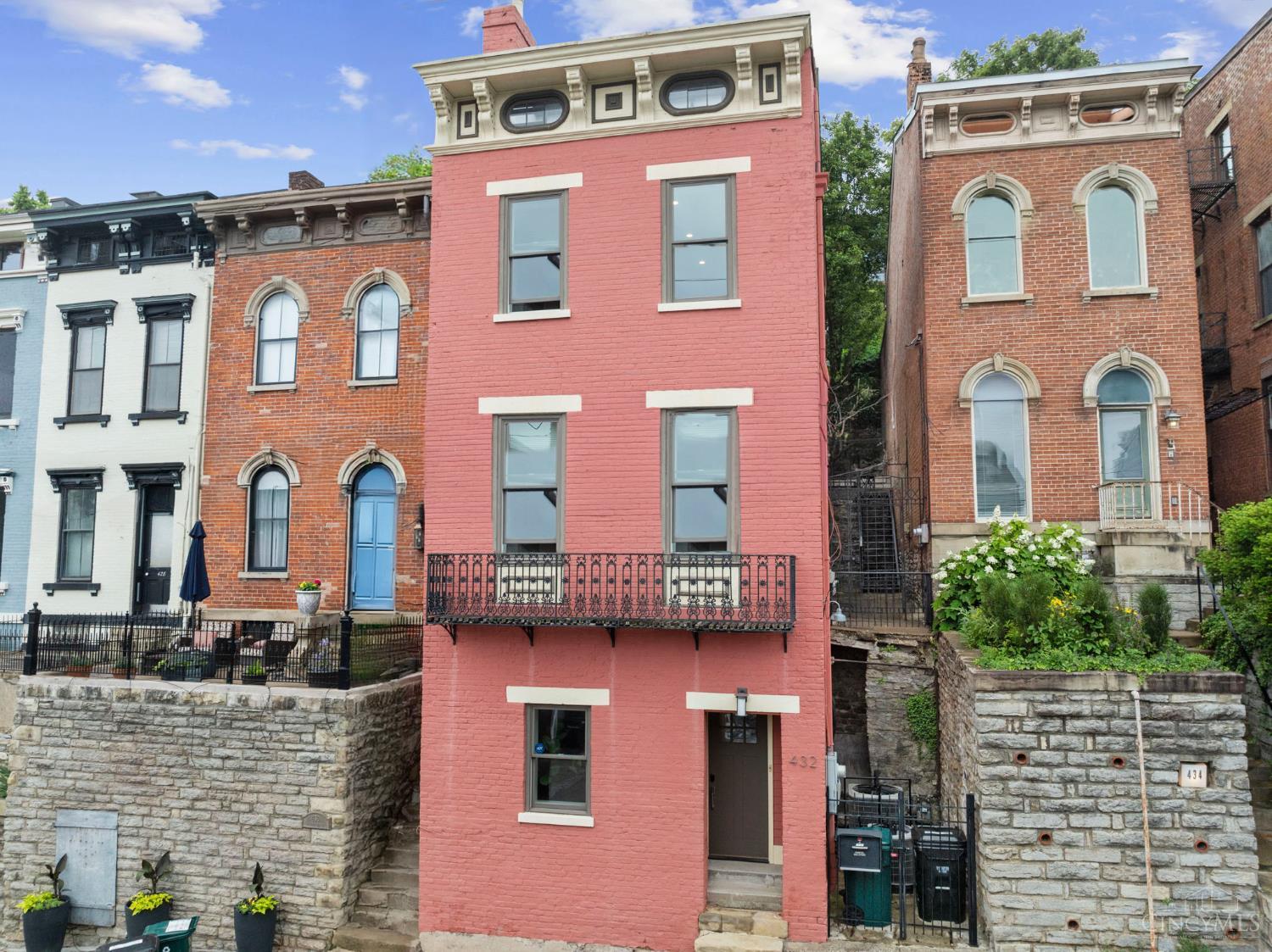 Welcome to this beautifully renovated gem in the heart of Prospect Hill where charm, space, & location come together in perfect harmony. This 4-bedroom, 4 full bath home checks every box, featuring an open & sun-filled main level w/ expansive living areas & panoramic skyline views. The spacious primary suite is a true retreat, offering two generous closets, a cozy wood-burning fireplace, & a luxurious ensuite bath. Step outside to your private backyard oasis brand new in 2023featuring a deck, balcony, low-maintenance turf, & lush landscaping, perfect outdoor privacy. From the front rooftop deck, enjoy panoramic city views. A private driveway accommodating two vehicles! Located just steps from the buzz of downtown, this home offers the best of both worlds: a peaceful & quiet community w/ easy access to restaurants, bars, & entertainment. Recent upgrades include new shingle roof in 2022, French doors in 2023, tankless water heater 2024, new hdwd flrs & freshly painted Inter. Zoned HVAC.