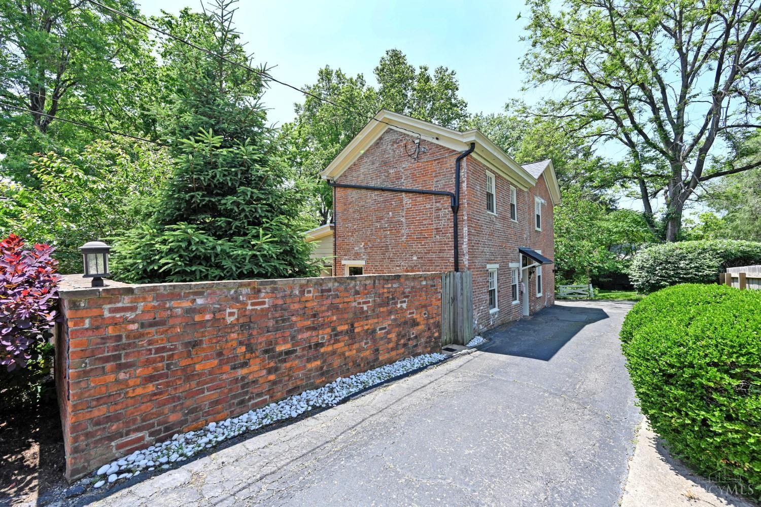 Experience quintessential Mt. Lookout charm in this brick cottage in the heart of the neighborhood! One of two original ML homes originally used as blacksmith and tannery. Tucked back on a private drive, this home is ideally located in between HP and ML! The backyard is an entertainer's dream and fully fenced. Lovingly updated w/ gourmet kitchen, 3 full bathrooms and 4 bedrooms. 3 ensuite  bedrooms, 1 bed/bath on first floor. Hardwood floors, exposed brick, beamed ceilings! Screened porch!