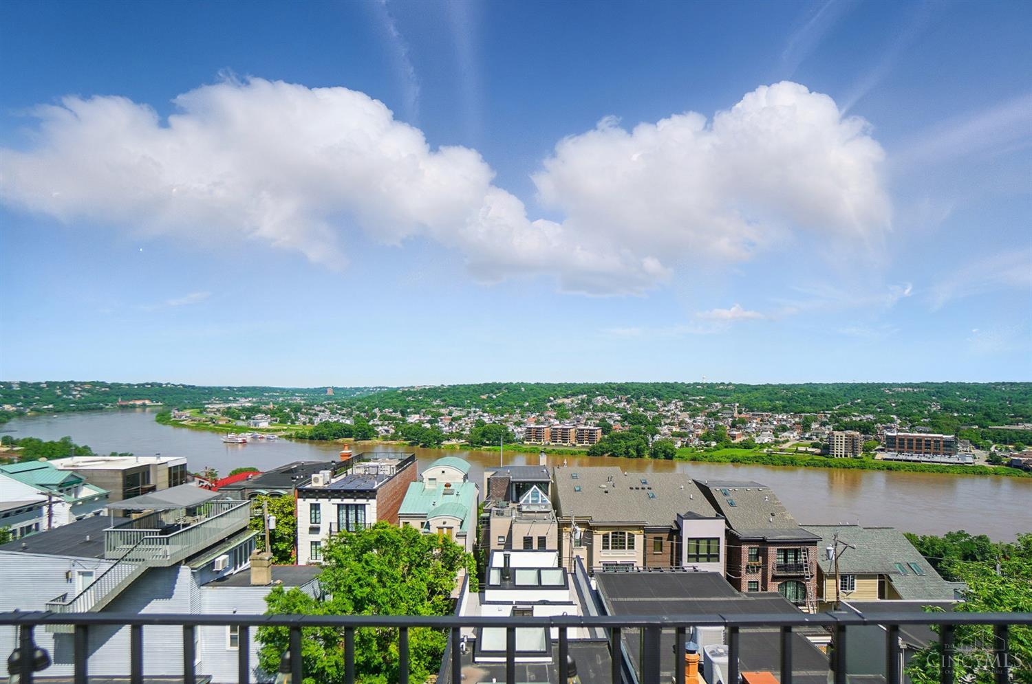 Wow! Spectacular urban living with phenomenal river & city views! Elevator access to all 4 levels - entertain or just relax on spacious rooftop terrace equipt with barbecue grill, refrigerator & TV hookup! Private guest suite w/ patio - rare side by side 2 car garage! Over 3,000 sqft!
