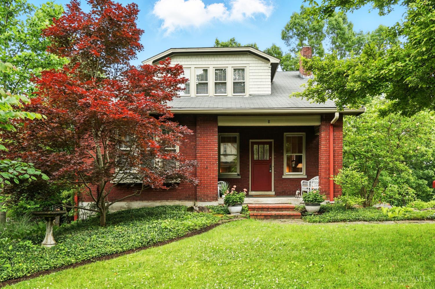 Tucked away on a private drive in the heart of Gaslight Clifton lies this enchanting 4BR/2BA 2-story Craftsman on over a 3rd of an acre of terraced grounds, lovingly maintained by 1 owner for over 25 years. The main level offers a primary w/ ensuite bath & adjoining family room, ideal for guests and first floor living. The main living space w/ handsome formal living & dining of gracious proportions, opens onto a 9 x 27 covered porch overlooking the beautifully tiered gardens below. Also walking out onto the back porch is the gourmet kitchen w/ JennAir, Bosch & Liebherr SS appliances. Upstairs you'll find three more comfortable bedrooms - one with dual closets, another with a large walk-in - all served by a full hall bath with charming original finishes off the airy landing. The LL includes laundry, rec room, storage, and optional study as well as access to the built-in oversized 1 car garage, driveway & backyard beyond. Enjoy the best of both - peaceful setting still close to it all.