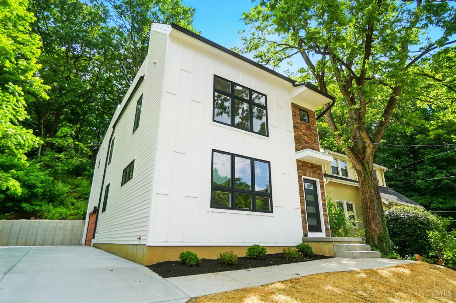 Discover the perfect blend of modern style and smart investment in this brand new home built by Ashford Homes. Enjoy 15 years of tax abatement, making ownership even more affordable. With 3 spacious bedrooms, 2.5 bathrooms, and a full basement with bathroom rough-in, there's room to grow and customize. The open-concept layout features sleek finishes, a 2-car garage, and a private rooftop deck, ideal for relaxing or entertaining. Every detail is brand new, giving you peace of mind and low maintenance living. Don't miss this opportunity to own a quality-built home with lasting value! Gold Leed Certified
