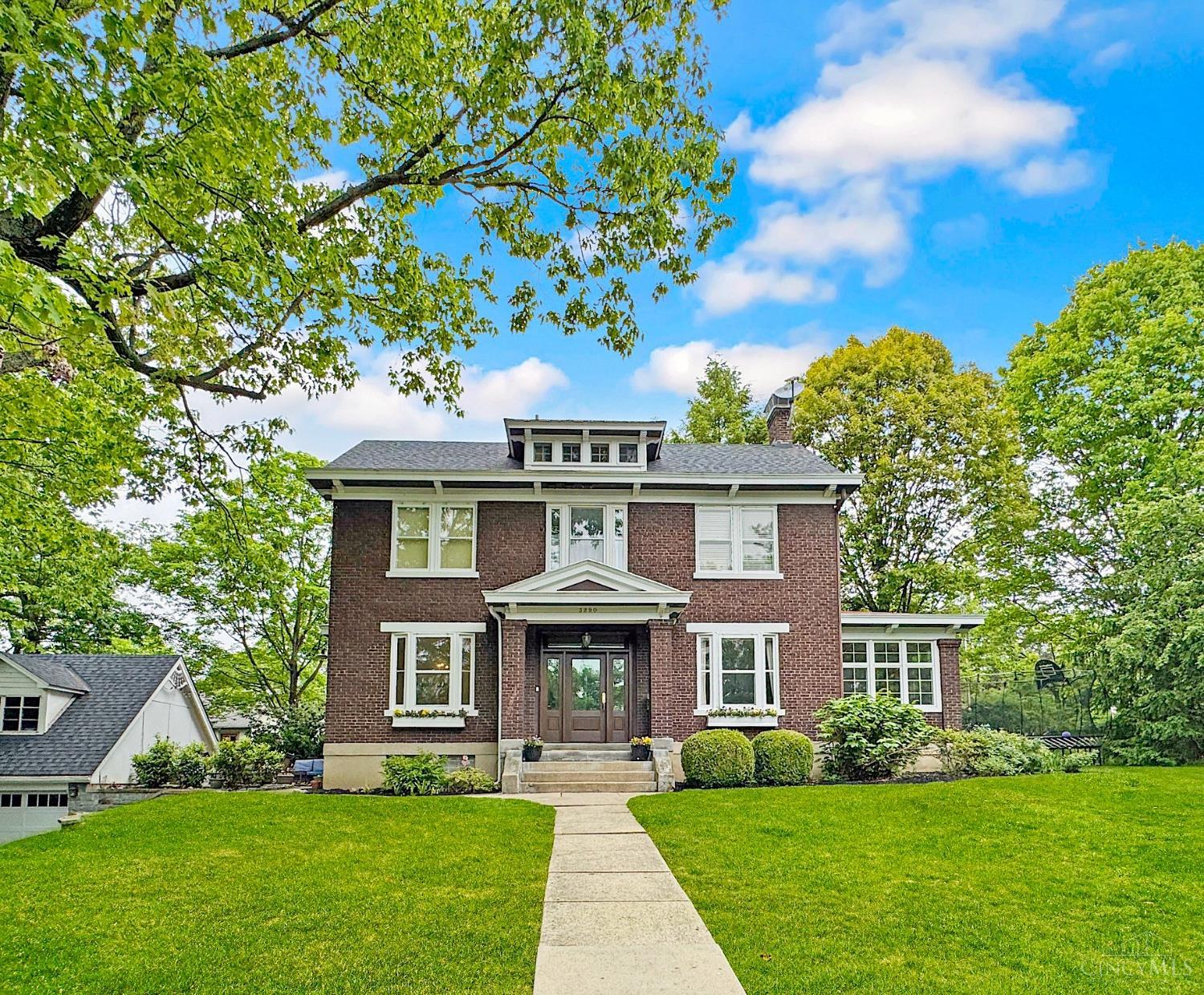 Timeless brick Colonial with many recent upgrades in the beautiful Observatory Historic district! The spacious, versatile layout is ideal for cozy comfort or entertaining guests. Elegant Foyer, crown molding, French doors, custom built-ins. First floor Living Room and Family Room. Remodeled Kitchen with 42 inch cabinets, granite, new appliances, 5 burner gas range, and Butler's Pantry with bev fridge! Professionally finished lower level in 2023 with Media Room, Rec Room, wet bar, and Bathroom! Primary Suite retreat with beamed ceiling, window seat, new Full Bath 2023! 2nd floor Laundry added. 2 Bedrooms with Jack & Jill Bath PLUS 2 more Bedrooms and new Full Bath on 3rd floor. Detached Garage with new door and loft area above. New Roof 2023, AC 2022, Furnace 2020. Amazing location near Ault Park!