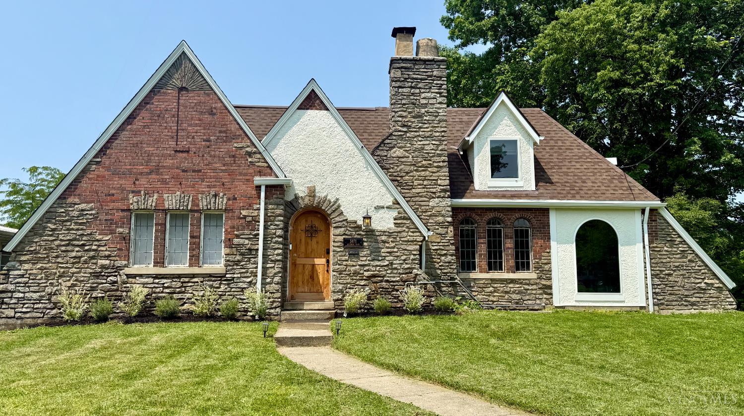 Stunning, meticulously renovated 4-bedroom, 2.5 bathroom home at 5071 Anderson Place, nestled in the vibrant Madisonville neighborhood of Cincinnati. This 1929-built gem has undergone a transformative renovation, seamlessly blending its classic charm with contemporary design. Step inside and experience the breathtaking open-concept floor plan, thoughtfully redesigned for modern living. Walls have been opened to create expansive, light-filled spaces perfect for entertaining and everyday life. Every detail has been carefully considered, from the high-end finishes to the seamless flow between rooms. **New Electrical System:** Rewired from top to bottom, providing efficient power throughout. **New HVAC System:** **12-year residential property abatement** from the City of Cincinnati. This means you'll only pay on the *pre-renovation value* of the home for the next 12 years, resulting in substantial annual savings.