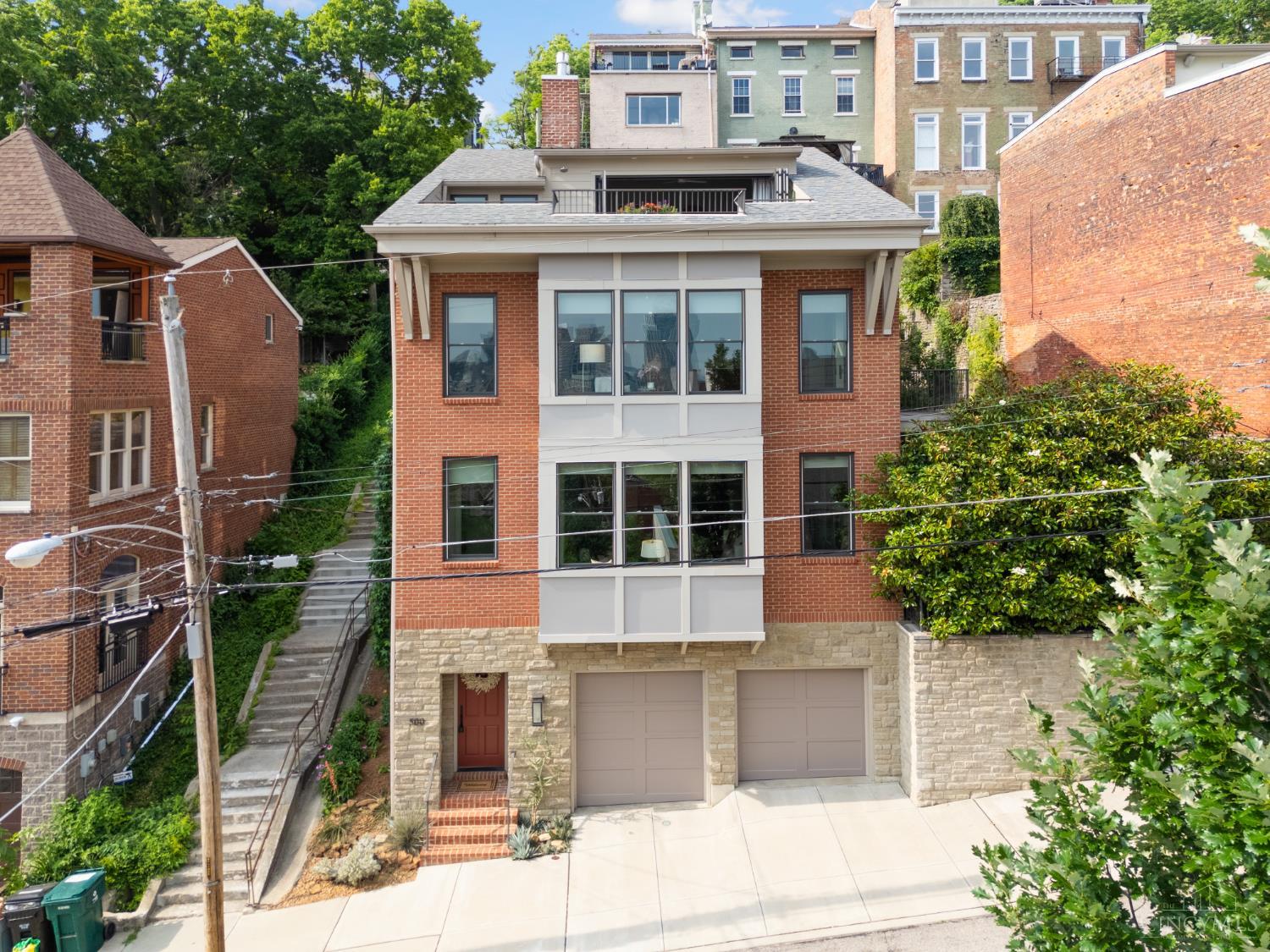 Architectural Gem! Custom-built LEED Platinum 4 story showcase! Stunning city views! Heated Year-Round Saltwater Pool! Fountain! Chef's kitchen with Bosch appliances, a downdraft range hood, plus leathered quartz waterfall island! Venetian plaster fireplace surround! Terraces! Sun deck! 9-13 ft ceilings! Spa baths! Meticulous craftsmanship, finishes & millwork in this world-class Prospect Hill home! 3 spacious bedroom suites (option for a 4th bedroom). Incredible Tax Abatement through 2032! Stunning primary suite with volume ceiling, fireplace, glamour bath, 2nd laundry facility, walk-in closet with custom built-ins & walkout to large rooftop terrace with an outdoor Grohe shower!  Equipped for an elevator, with the elevator shaft currently used as extra storage on each level. Terraced gardens! Specimen plantings. Oversized 2 car garage. Entertaining is a dream in this open floor plan! Walk to restaurants, bars, Findlay Market, Washington Park & more!