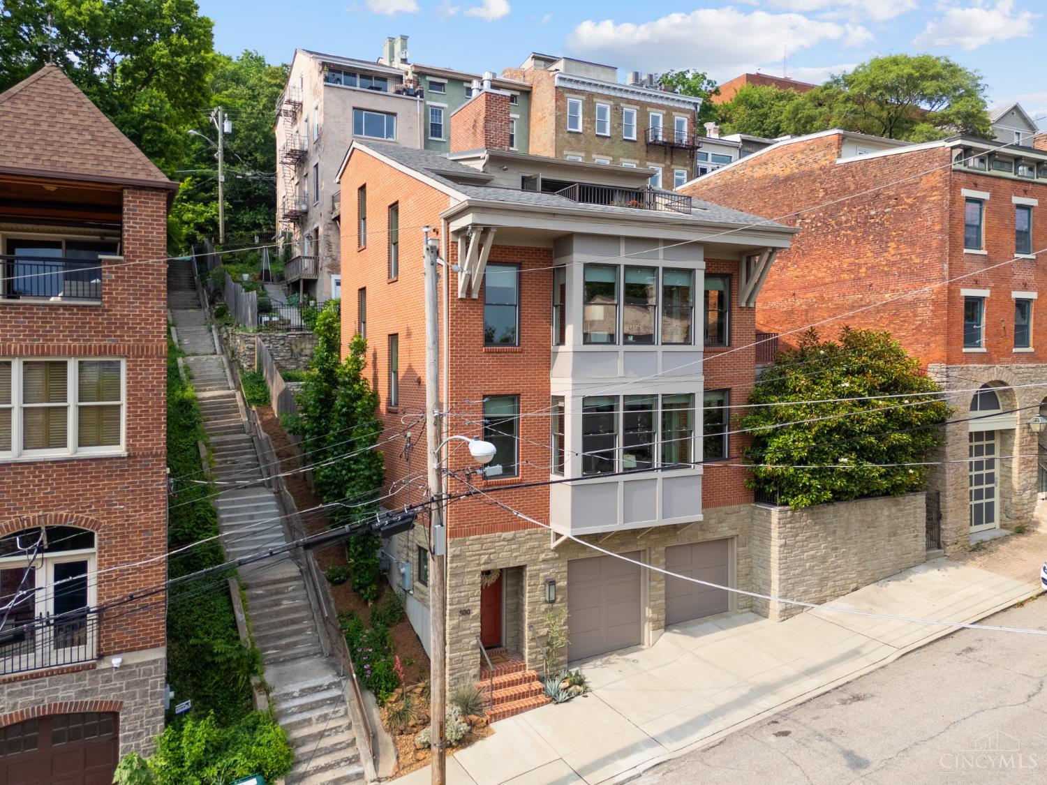 Architectural Gem!Custom-built-2017-LEED Platinum 4 story showcase!Sweeping city views!Heated Year-Round Saltwater Pool w/fountain!Chef's kitchen w/Bosch appliances, a downdraft range hood, plus leathered quartz waterfall island!Venetian plaster fireplace surround!Entertaining dream!Terraces!9-13 ft ceilings!Luxury spa baths!Meticulous craftsmanship, finishes & millwork in this world-class Prospect Hill home!3+ spacious bedrm suites (option for a 4th bedroom).Incredible Tax Abatement through 2032! Stunning primary suite w/volume ceiling, fireplace, glam bath, 2nd laundry facility, walk-in closet w/custom built-ins,refreshment bar & walkout to large rooftop sun deck w/an outdoor Grohe shower!Equipped for an elevator, w/the elevator shaft currently used as storage on each level.Gardens! Specimen plantings!Oversized 2 car garage.Entertaining is a dream in this open floor plan!Close to restaurants, bars, Findlay Market, Washington Park & more!Best value on the market!Immediate Occupancy!