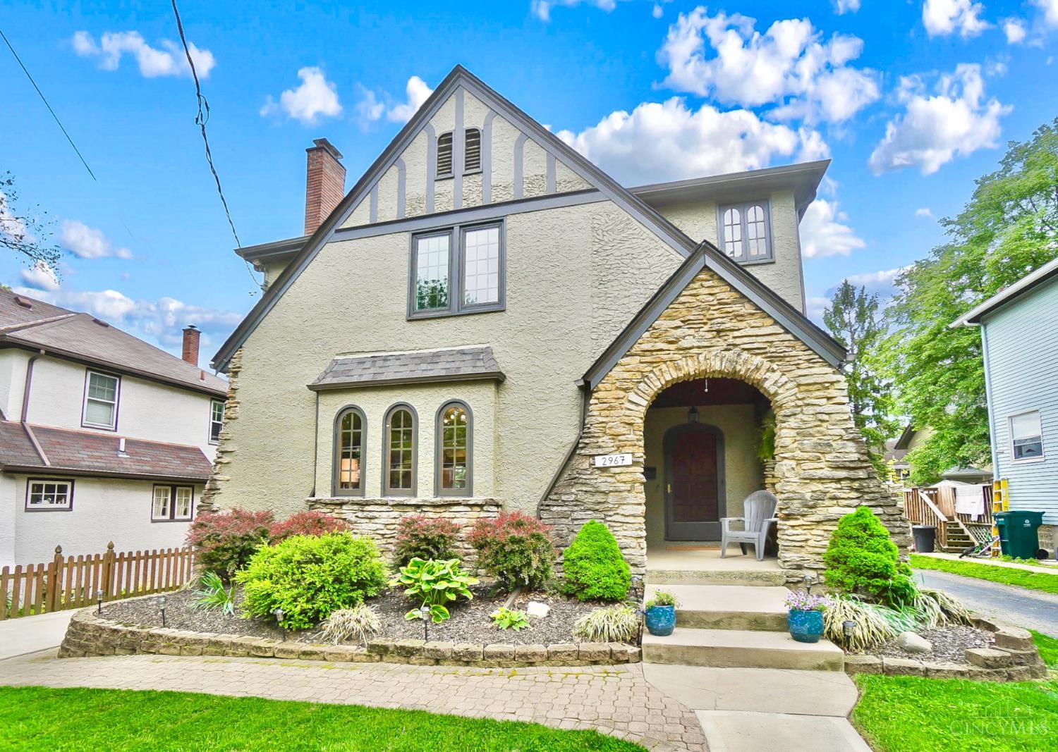 This storybook Tudor in Pleasant Ridge offers original charm plus recent renovations for the ultimate in modern sophistication! From the arched doors to the beautiful moldings, every detail has been updated and elevated. The elegant Foyer leads into a large Living Room with Rookwood fireplace. Stunning designer Kitchen with Quartzite island, custom bench, new appliances, and floating shelves. The warm glow of curated lighting including new dimmers throughout. New built-in Dining Room and Half Bath. Screened porch for year round enjoyment with new ceiling and fan. All new Full Bath in 2023! Remodeled Lower Level for Family Room and Fitness area, and Office. Interior/Exterior painted and insulation added throughout home in 2023. New Roof, Electric, Water Heater 2023. New Furnace 2021. Fantastic new deck 2023, steps down to the fenced yard and patio. Amazing home where timeless meets totally turn-key! Tax abatement through 2035!