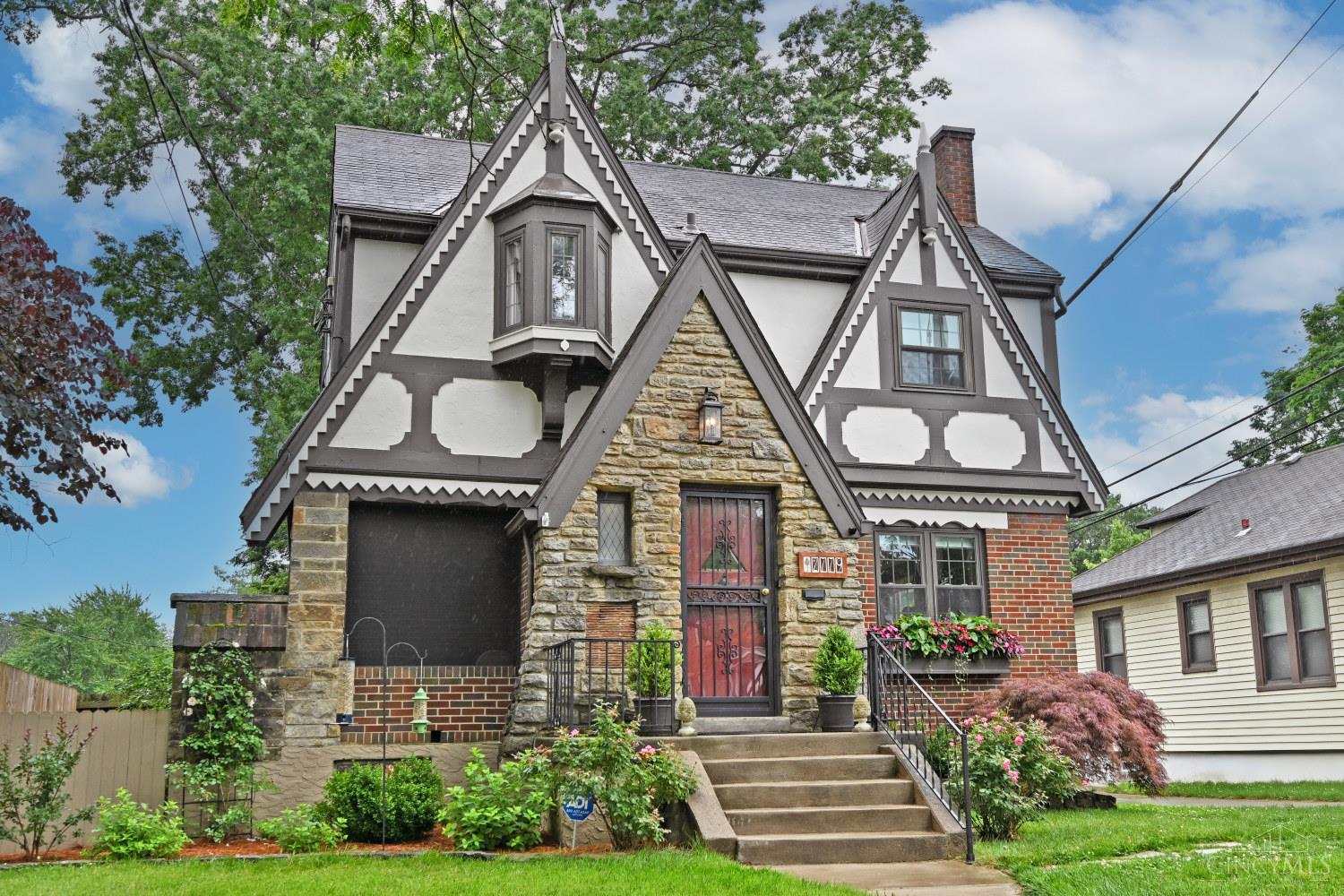 Immaculate Tudor in the heart of Oakley.  Thoughtfully renovated while keeping a lot of original character intact.  Gorgeous kitchen with custom woodwork.  Renovated baths.  Hardwoods throughout.  Finished lower level family room with half bath (with room to convert to a full.)  TWO gas fireplaces.  Amazing new covered deck.    Relaxing screened porch.  Fully fenced yard.  Brand new gutters, gutter guards & downspouts are being installed the week of June 23. Wired for EV charger. Wonderful walkable location!