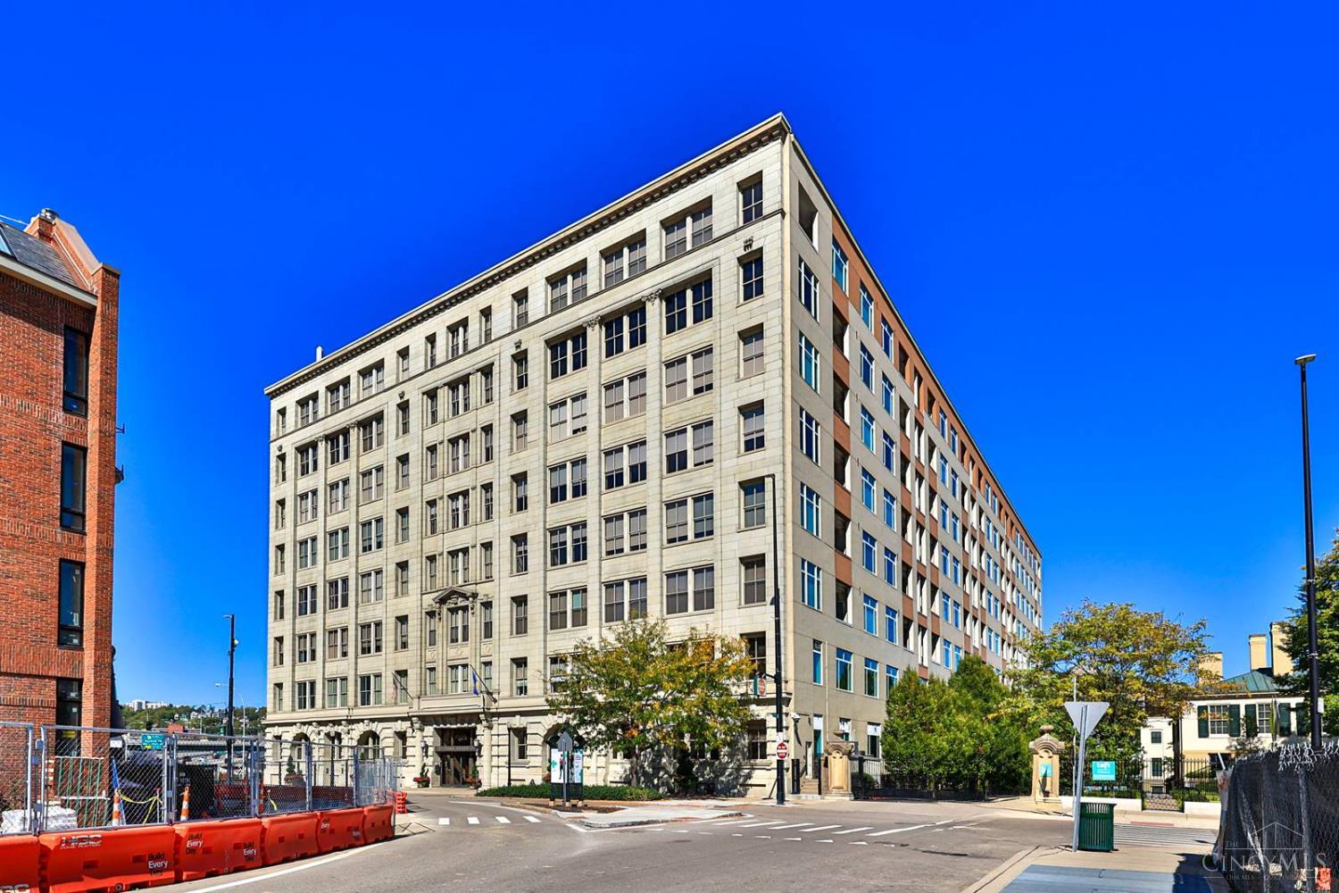 Discover your perfect downtown Cincinnati condo! This bright and spacious home offers a comfortable and modern lifestyle, complete with parking and additional storage. New water heater & floors since 2020. Enjoy the convenience of being steps away from the best restaurants, entertainment, cultural spots, and markets in downtown & Over-the-Rhine. Whether you prefer to walk, scooter, roll, or drive, everything is within easy reach. The building offers top notch amenities including 24/7 front desk security, a fitness center, and a party room - all in a pet-friendly environment with easy access to major expressways. Traveling? Just lock the door and you're off!