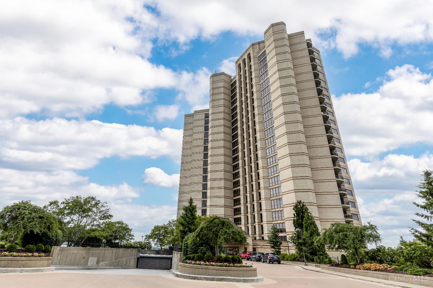Fabulous Edgecliff Place with beautiful views of the river and hills of Kentucky. Light, bright open living/dining area. Three balconies provide outdoor  access from every room. Large primary suite with 2 walk in closets and new carpet. Primary bath has great storage and whirlpool tub. Study with wet  bar and built-ins. Large kitchen and laundry room with plenty of storage.  Front desk concierge, exercise room, outdoor pool, guest suites and party  room in the Maxwelton House. Unit has 2 garage spaces and a storage room.