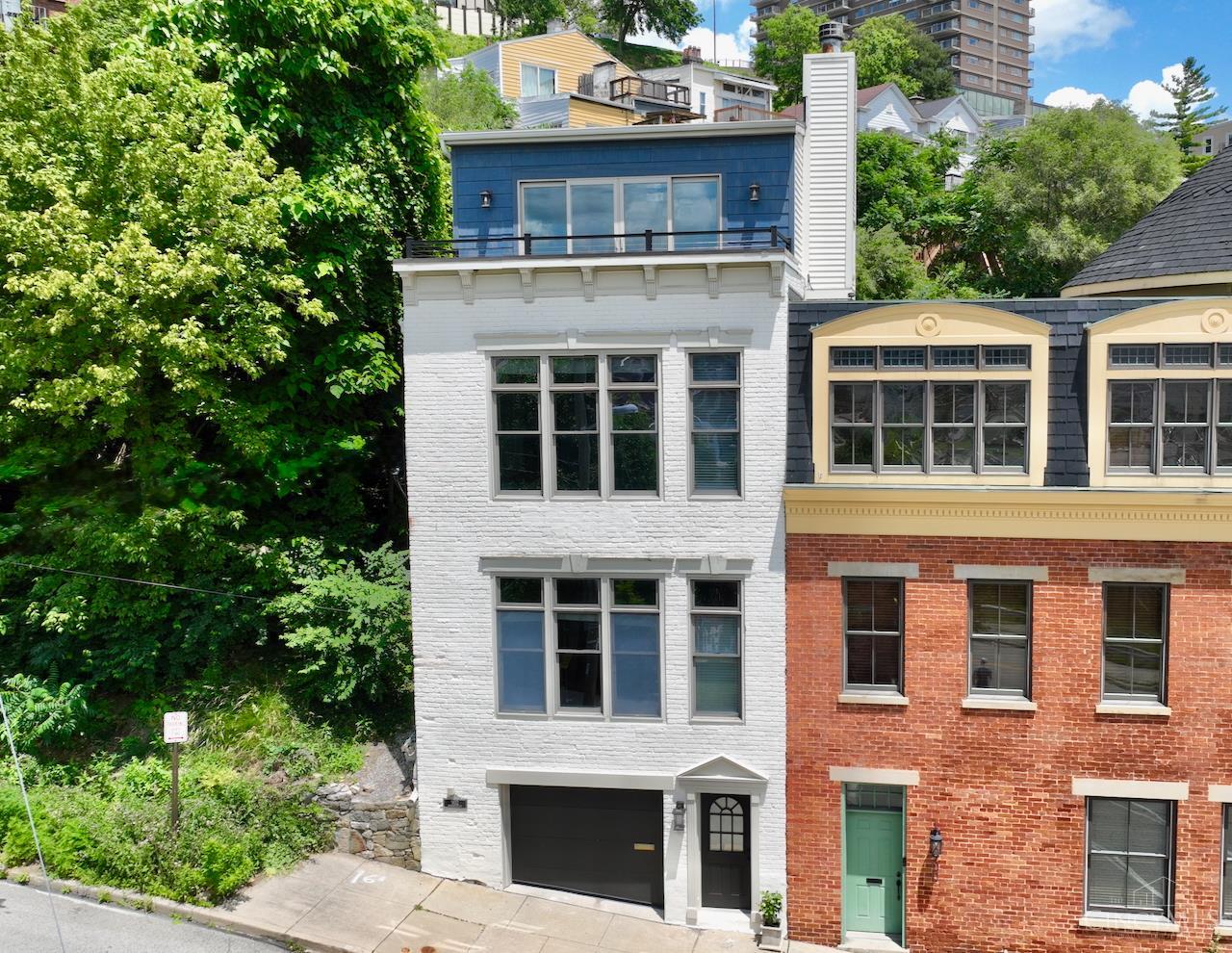 Fantastic 2bed/2.5bath townhome in Mt. Adams with panoramic views of the Downtown skyline from every floor! Relax on the private roofdeck w/adjacent family room & wet bar. Open kitchen w/gas cooktop, glass tile backsplash & double oven. Large primary suite w/en suite, walk-in closet w/organizers & stunning city views. Primary bedroom ensuite offers double sink, large shower & soaking tub. Convenient 2nd floor laundry. Rare 2 car tandem garage & spacious backyard garden. Steps away from some of Cincinnati's most iconic attractions, including the Cincinnati Art Museum, Krohn Conservatory, Eden Park and the vibrant Mt. Adams business district.