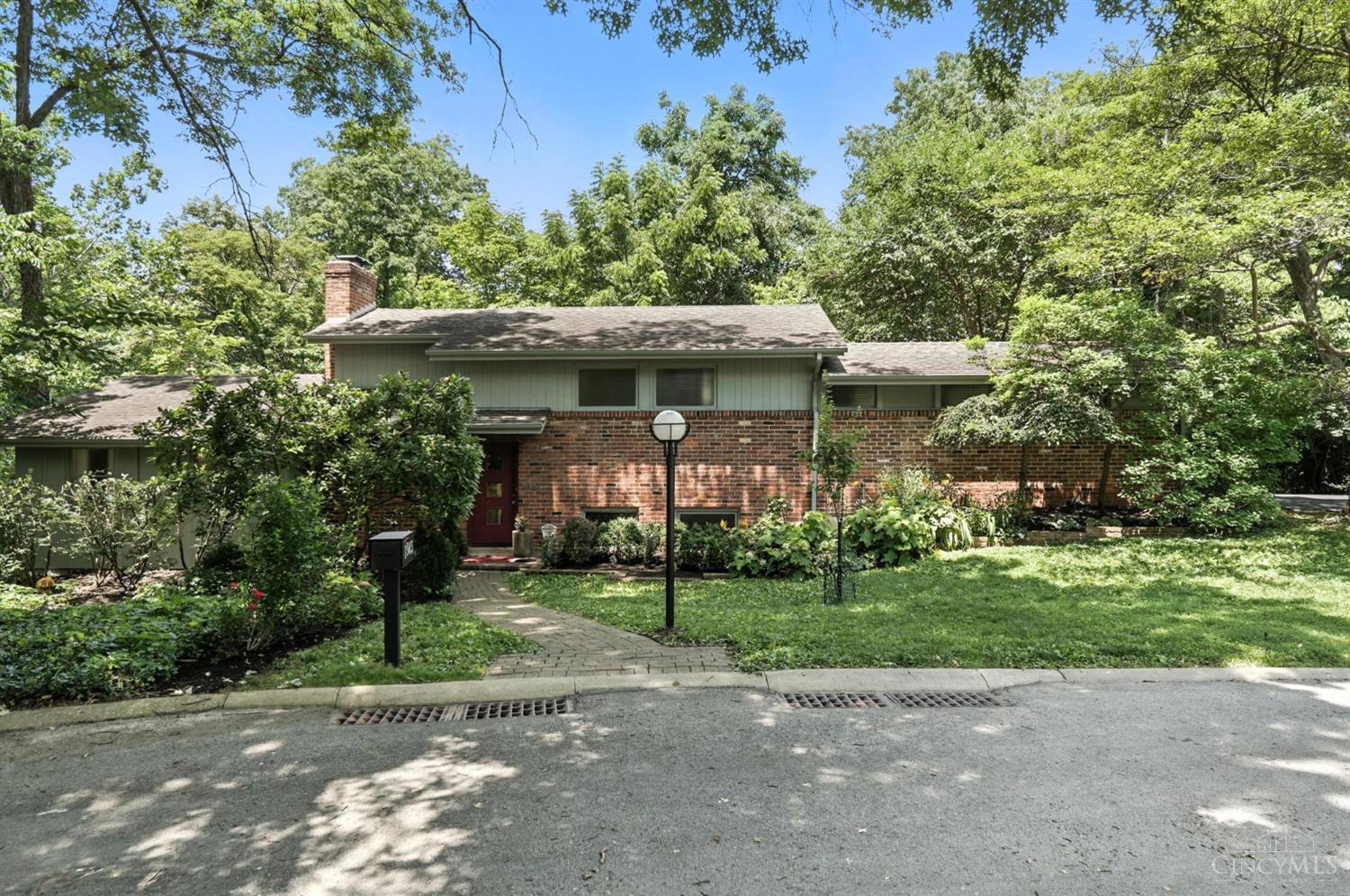 This spectacular mid-century home is situated in a park-like setting in a cul de sac.  With 360 degree wooded views, you will feel like you are at a private retreat .  Relax and enjoy nature on the spacious patio, or restore yourself in the built in sauna.  Large windows allow abundant natural light.   Conveniently located in East Walnut Hills,  this home is close to shopping, downtown, and everything the city has to offer. Surrounded by million-dollar homes, this is a rare opportunity to own a true architectural gem in an unbeatable location.