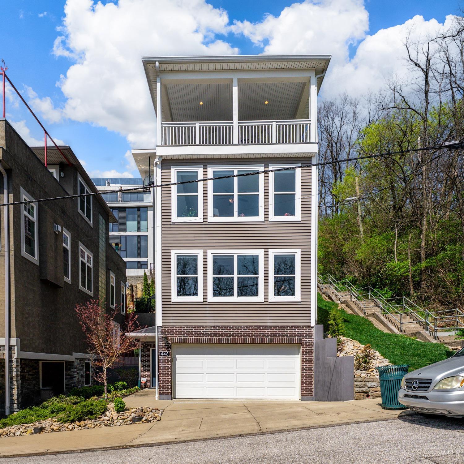 Save over $8,000/year through 2031 with a Silver LEED tax abatement from the city of Cincinnati! This modern 4-story home offers stunning city views and an open floor plan. Features include 2 bedrooms, 4 baths, and a top-floor bonus room that can easily convert to a 3rd bedroom or office. Enjoy granite countertop in the kitchen, primary bath, and bonus area. Rare for city living, this home includes a 2-car garage with premium Nature Stone flooring. Built in 2016 with sleek finishes, natural light, and a covered terrace, perfect for entertaining! Less than a mile to I-71 and just minutes to shopping, dining, entertainment, and sporting events. From this location, you're just over a mile from Fountain Square, a few minutes to OTR, Washington Park, Findlay Market, the banks, and the Hard Rock Casino. This is urban living at its best. Tax abated through 2031