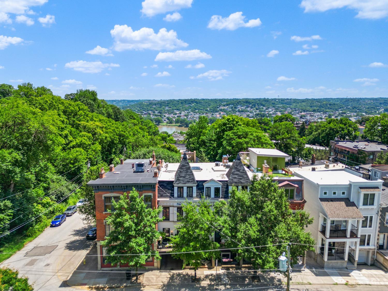 Pristine & beautifully updated condo in a park like setting in the heart of Mount Adams! Fully renovated in 2022, this condo boasts two spacious bedrooms with custom closet systems & a potential third bedroom currently being used as a study. Elegantly updated kitchen with custom cabinets, quartzite counters, gas stove, custom island & built in bar/coffee station. Eat-in kitchen/dining has banquette seating with added storage. Three private balconies with views, laundry in-unit, new interior & exterior doors, new high end lighting throughout, freshly painted, updated electric, added gas fireplace in Living Room, new solid white oak floors throughout, reserved parking space in rear. Two mini splits added to third floor. Nothing has been left untouched!