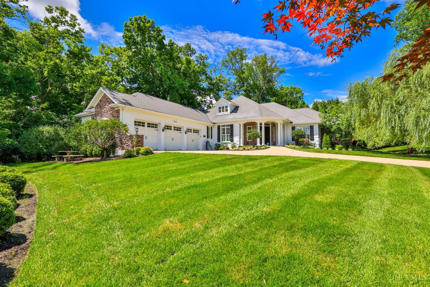 Beautiful home in an idyllic setting!Soaring ceilings, light-filled spaces, & custom details create an inviting atmosphere. Enjoy gleaming hardwood floors, beamed ceilings, & a seamless flow from the kitchen to other rooms. French doors open to a private study on the 1st level. The great room walks out to a covered rear porch overlooking the scenic yard, gorgeous gardens, mature trees, & professional landscaping that provide beauty & privacy. The primary suite includes a bath & spacious walk-in closet. The finished LL is impressive, featuring cork flooring, large rec room, family room, exercise area, & a generous storage room for all your needs. An elevator adds convenience. Additional highlights: tax abatement, generator, security system, & electric car hookups. Every detail is designed for comfort & peace of mind. Offers open for 48 hours. No escalation clauses.