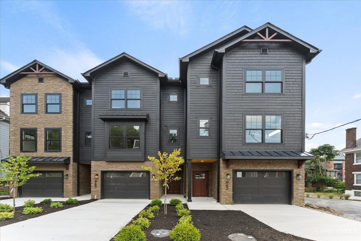 New Gold LEED-certified townhome in Walnut Hills. 2,300+ sqft of elevated, on-trend design. Open layout with tall ceilings, natural light, hardwood floors, gas fireplace, gorgeous fixtures and finishes throughout. Gourmet kitchen features a large island, quartz counters, pantry, stylish backsplash, and stainless appliances.3 beds, plus flex room for a 4th, each with its own private en-suite bathroom. Primary suite features a walk-in closet and spa-like bath. Conveniently placed laundry near bedrooms. Walkout deck with wooded views plus a covered lower patio and tree-lined backdrop. Oversized garage, guest parking, and 15-year tax abatement. Nearby parks, shops, dining and more! Just minutes to downtown, I-75 and Columbia Parkway.