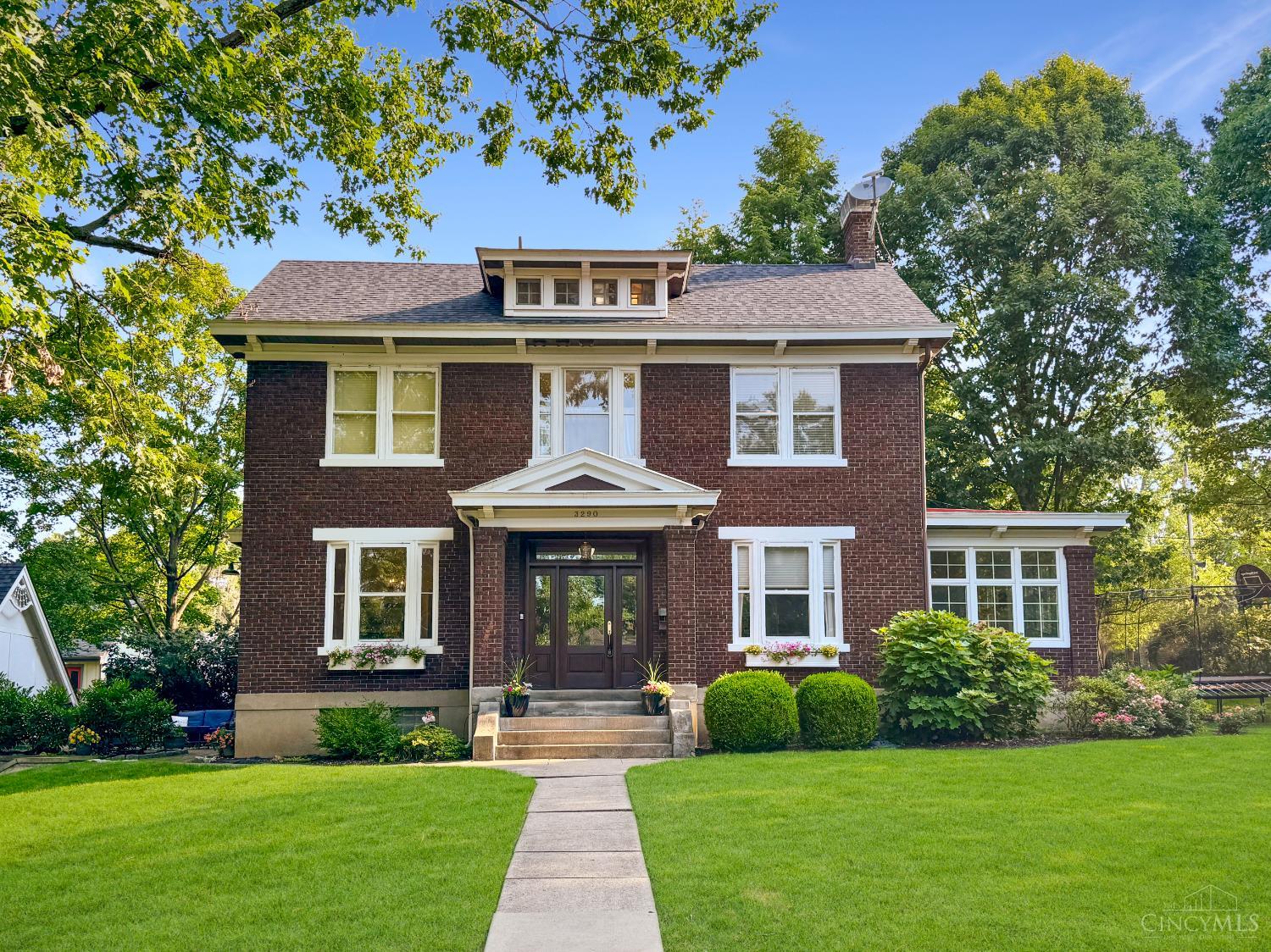 Timeless brick Colonial with many recent upgrades in the beautiful Observatory Historic district! The spacious, versatile layout is ideal for cozy comfort or entertaining guests. Elegant Foyer, crown molding, French doors, custom built-ins. First floor Living Room and Family Room. Remodeled Kitchen with 42 inch cabinets, granite, new appliances, 5 burner gas range, and Butler's Pantry with bev fridge! Professionally finished lower level in 2023 with Media Room, Rec Room, wet bar, and Bathroom! Primary Suite retreat with beamed ceiling, window seat, new Full Bath 2023! 2nd floor Laundry added. 2 Bedrooms with Jack & Jill Bath PLUS 2 more Bedrooms and new Full Bath on 3rd floor. Detached Garage with new door and loft area above. New Roof 2023, AC 2022, Furnace 2020. Amazing location near Ault Park! Walk or bike to Hyde Park Square, East Hyde Park, Wasson Way, and Hyde Park Plaza.