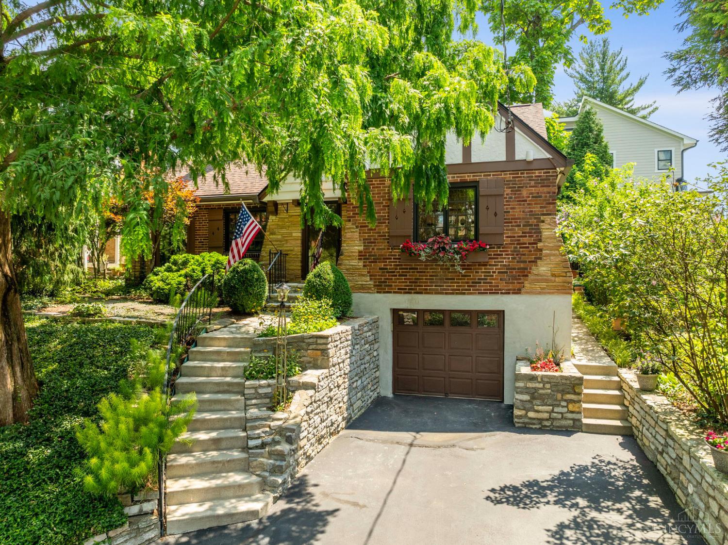 Pristine and meticulously cared-for Hyde Park Tudor! Enjoy the quiet privacy that this hidden cul-de-sac street offers - all while walkable to Hyde Park Square, East Hyde Park and Wasson Way Bike Trail!   Extensive 2000 remodel - true to period style - primary suite w/ skylights, custom ceramic bathroom, heated floors, gas fireplace, walk-in closet, sitting area, kitchen w/ quartz and KitchenAide appliances, wine cooler, wood/clad Anderson windows and doors. First floor living is a reality w/ (2) additional bedrooms - both w/ walkouts - full bath, study w/ heated flooring. Hardwoods, original detailed trim-work throughout. Lower level boasts walk-in wine cellar, half-bath rough-in and potential for recreation room. Enjoy relaxing and entertaining on the shaded, private rear patio, beautifully landscaped w/ fountain feature. New roof w/ warranty, quartz counters, freshly painted - Spring 2025. Past owner loved this home for almost 30-years and now it's your turn! OPEN Sat. 7/19, 11A-1PM