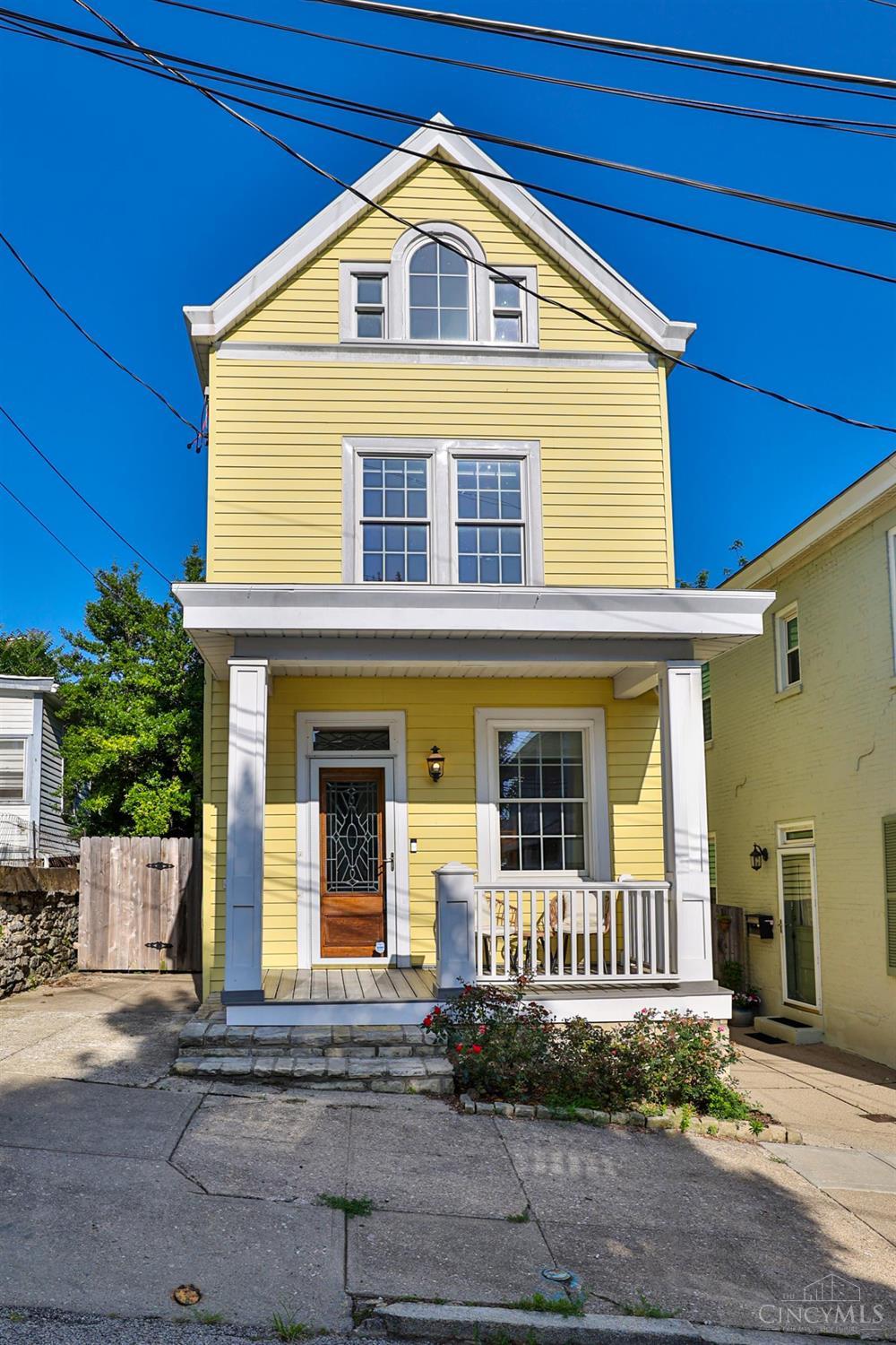 All that you want for Mt Adams living! Updated 3 bed + office, 2.5 bath with sleek modern updates blended with historic charm. Remodeled eat-in kitchen w/SS appliances, movable island and enormous pantry, walks out to professionally designed garden patio with new privacy fence and 8-person hot tub. Bath on each floor, spacious  primary bath! Custom built sauna in LL. Cozy front porch, and 2nd floor deck. Beautiful hardwood! Custom built-ins! Designer fixtures! Numerous recent updates! Off-street parking pad. Short walk to everything on The Hill!