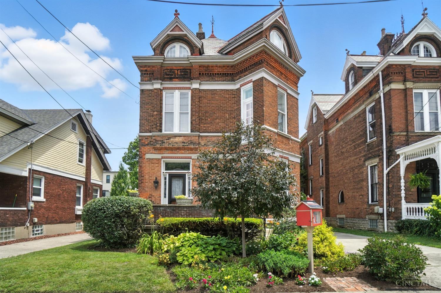 Step back in time with this meticulously maintained 3-story Victorian, nestled in the historic Cleinview-Hackberry district of East Walnut Hills. This architectural gem seamlessly blends timeless charm with modern comfort, offering 4 bedrooms, a dedicated study, 3 full baths, second-floor laundry, and a spacious third-floor recreation room. The updated kitchen features warm wood cabinetry, granite countertops, and stainless steel appliances, with walkout access to a private rear deck ideal for everyday living and effortless entertaining. Inside, you'll find generous room sizes, soaring ceilings, original wood trim, a dual-zoned HVAC system, and updated electric. Located just one block from the vibrant DeSales Corner and Woodburn entertainment district, you'll enjoy easy access to popular eateries, bars, and boutiques in one of Cincinnati's most dynamic neighborhoods. Showings Start 7/18
