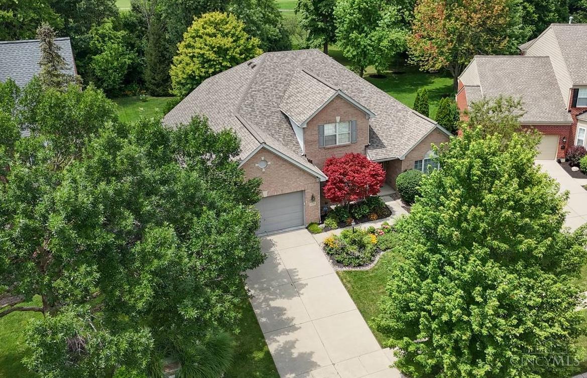 Exceptional 2-story home in the sought-after Four Bridges Community! Enjoy the 1st FL primary suite featuring a NEWLY UPDATED and spa-like bathroom and a luxurious soaking tub. The light-filled kitchen boasts stainless steel appliances, a gas cooktop, and generous space for cooking and gathering. The vaulted family room offers a sunny and comfortable atmosphere for relaxation. On the second FL, you'll find three additional bedrooms and a full bath. The newly finished lower level is perfect for entertaining and everyday living, complete with a full bathroom, large bar, recreation space, family room, and a dedicated home gym. Step outside to a private backyard oasis with mature trees, a new Trex deck, and a hot tub with privacy fencing. Enjoy distant golf course views from your own yard on this quiet cul-de-sac street. Must see in an exceptional location that is close to highways, shopping, dining, parks, and more!