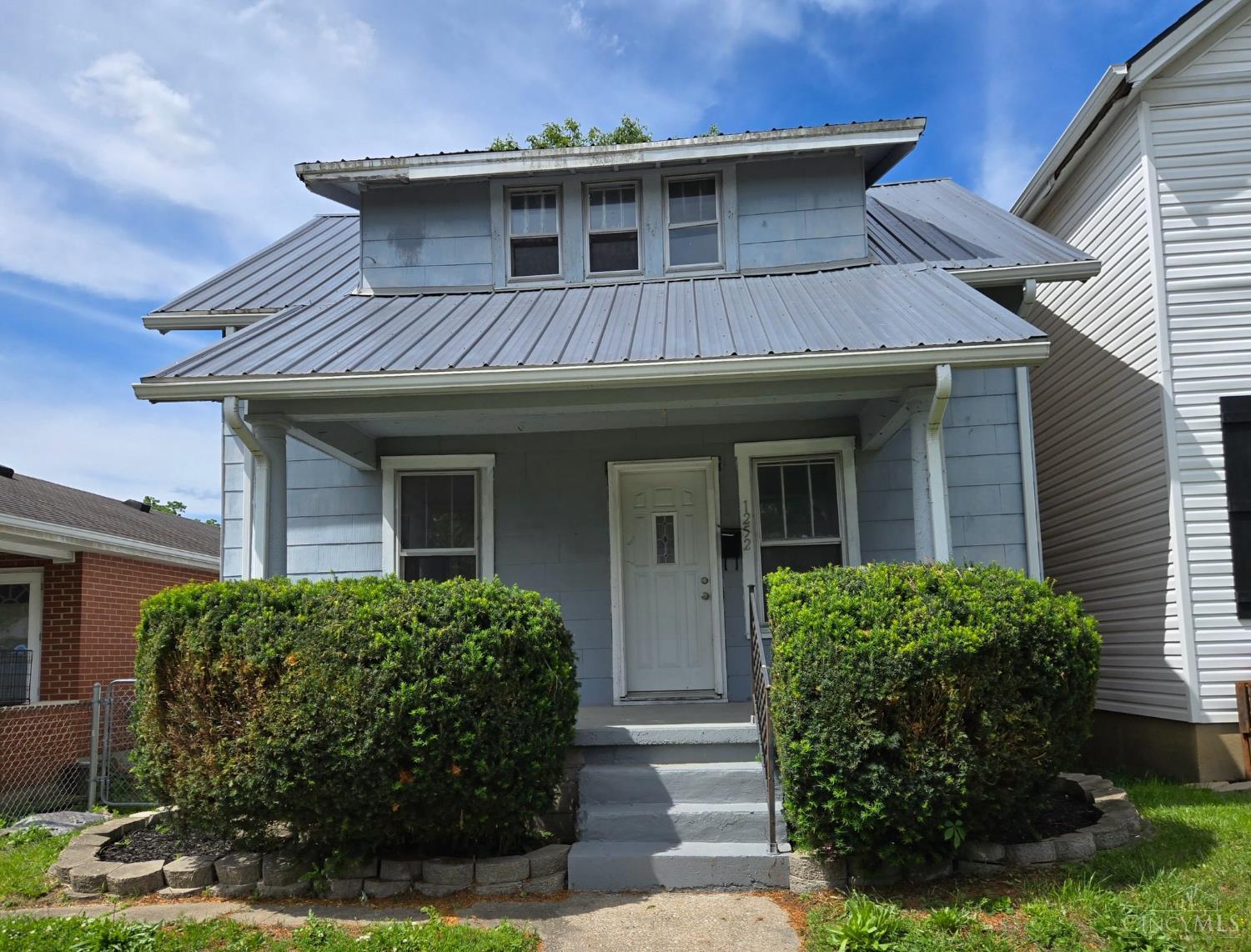 Welcome to this, 2-bedroom, one bath home ideally located just minutes from shopping and dining on Hamilton's West Side. This inviting property features fresh paint and newer carpet throughout, offering a clean and modern feel.  The spacious deck is perfect for entertaining or family gatherings.