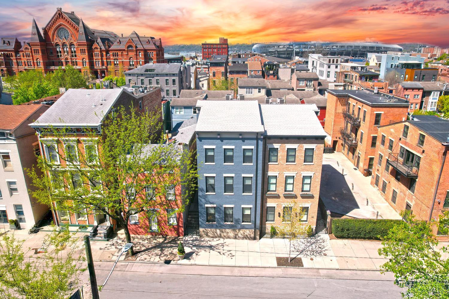 Show Stopper! Stunning Single Family Home in the Heart of OTR! Built in 2020, this house has a 2-car garage plus 3 additional parking spots in the driveway! LEED-Platinum tax-abatement thru 2035 with over $1,000,000 of abatement. Offering over 4,350 square feet of luxurious finished space, this residence features 4 bedrooms, 3 full baths, and 2 half baths - thoughtfully designed for both everyday comfort and exceptional entertaining. Enjoy the primary suite with a large bathroom and walk-in closet. Additional highlights include an expansive balcony with a gas fireplace, a second-floor laundry room, a dedicated first-floor office or study, and a finished lower level complete with a guest bedroom and full bath. Truly an exceptional opportunity only steps from Washington Park, FC Cincinnati, restaurants and shopping!