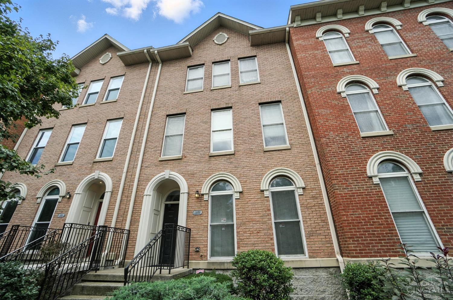 Fabulous Attached Townhome in the heart of it all! Over 2,500 square feet of beautiful living space. 4 bedrooms, 2 1/2 Baths.  First-floor offers the 4th bedroom or a private Office/Study with double doors and a large laundry room + bonus area to use for exercise or a mudroom. Huge entertaining area with a Seamless Open kitchen, Quartz counters and lots of natural Sunlight! Open floor plan. Primary Bedroom has vaulted ceilings and a spacious en-suite.  Quaint Patio deck with pretty city views. Built-in 1 car garage. Enjoy the lovely evening views and short walks to TQL Stadium, Findlay Market, Union Terminal and many parks, fantastic restaurants and Over-The-Rhine amenities... Perfect City Living!